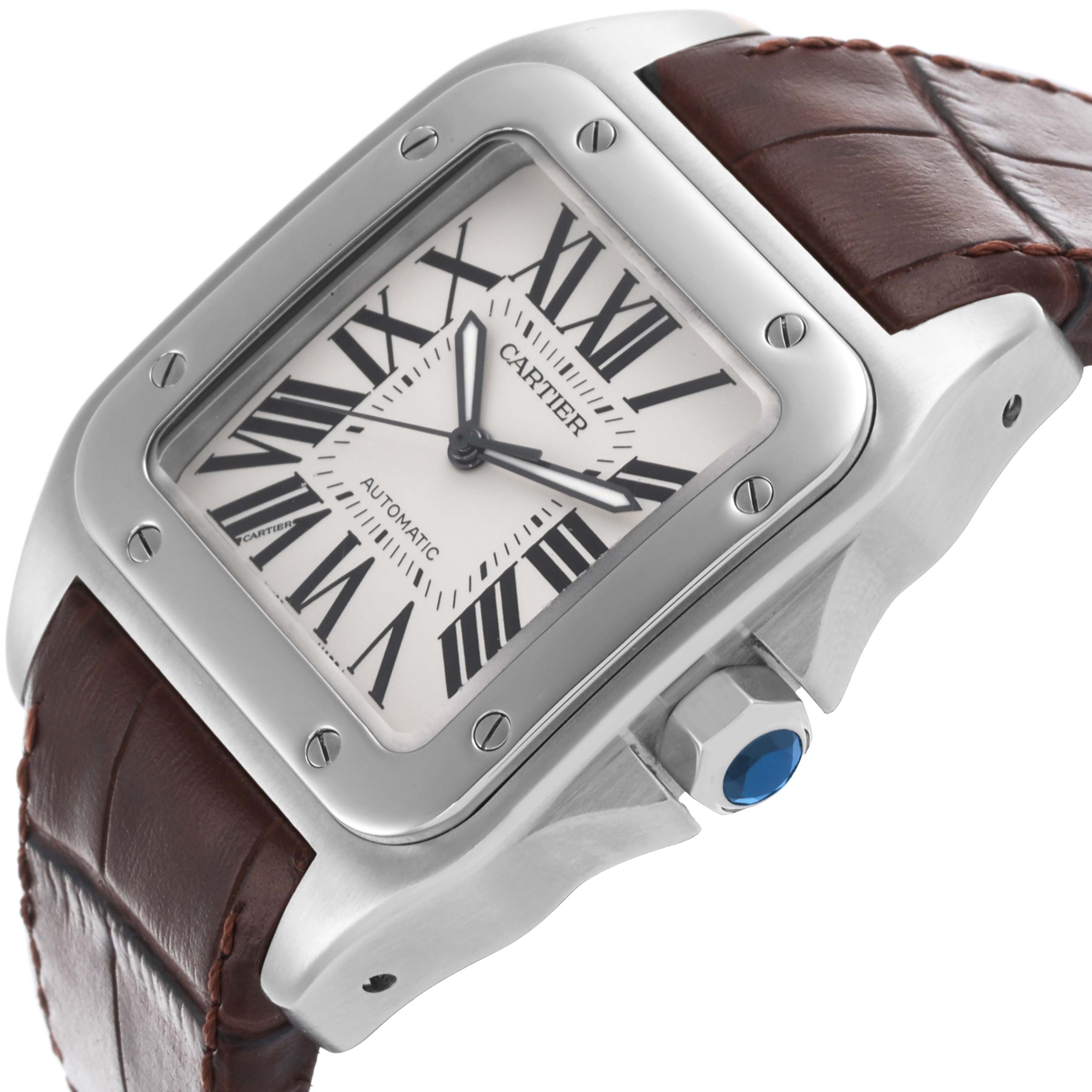 The Cartier Santos W20073X8 Men
s Stainless Steel Silver Dial W20073X8 Men
s Stainless Steel Silver Dial watch is shown at a top-side angle, displaying the face, bezel, crown, and leather strap.
