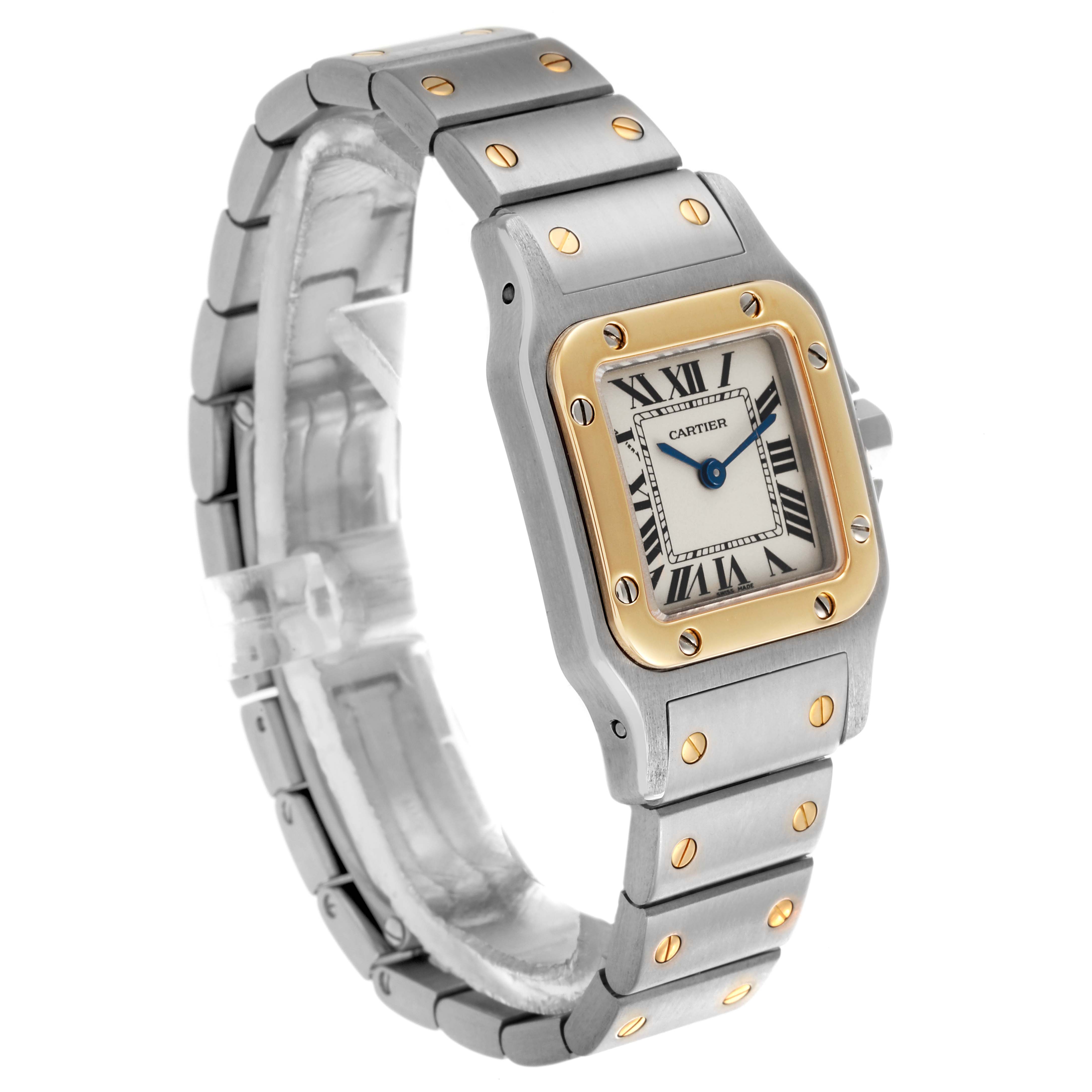 The Cartier Santos W20012C4 Women's Steel and Gold (two tone) Silver Dial W20012C4 Women's Steel and Gold (two tone) Silver Dial watch is shown from a side angle, displaying the face, bezel, and bracelet.