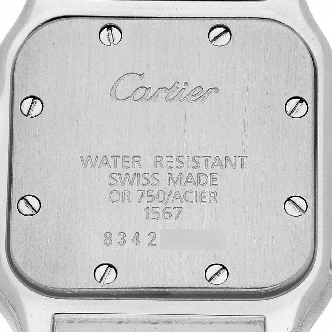 The image shows the back case of a Cartier Santos W20012C4 Women's Steel and Gold (two tone) Silver Dial W20012C4 Women's Steel and Gold (two tone) Silver Dial watch with engravings and screws visible.