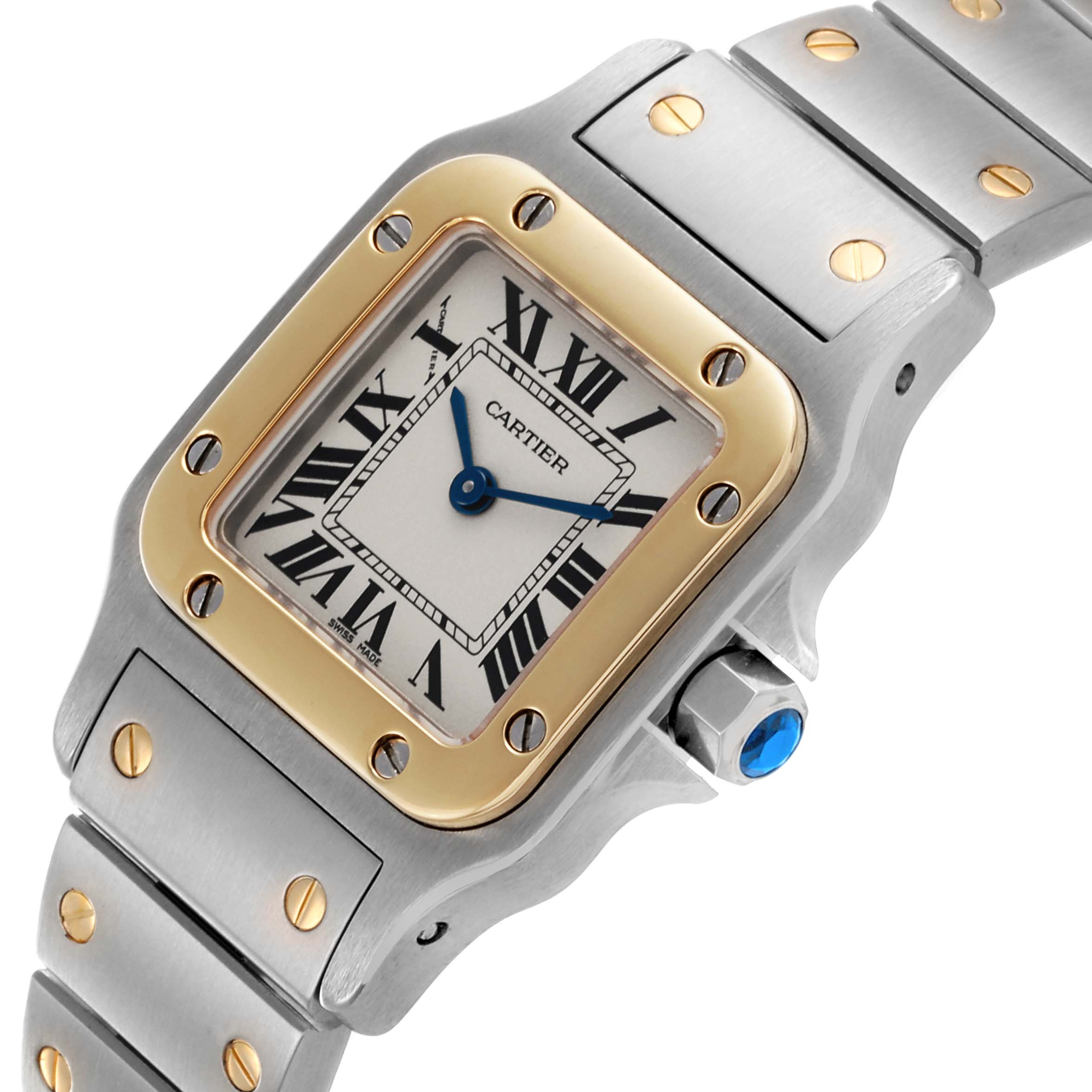 The Cartier Santos W20012C4 Women's Steel and Gold (two tone) Silver Dial W20012C4 Women's Steel and Gold (two tone) Silver Dial watch is shown at an angled view, highlighting the dial, bezel, crown, and part of the bracelet.