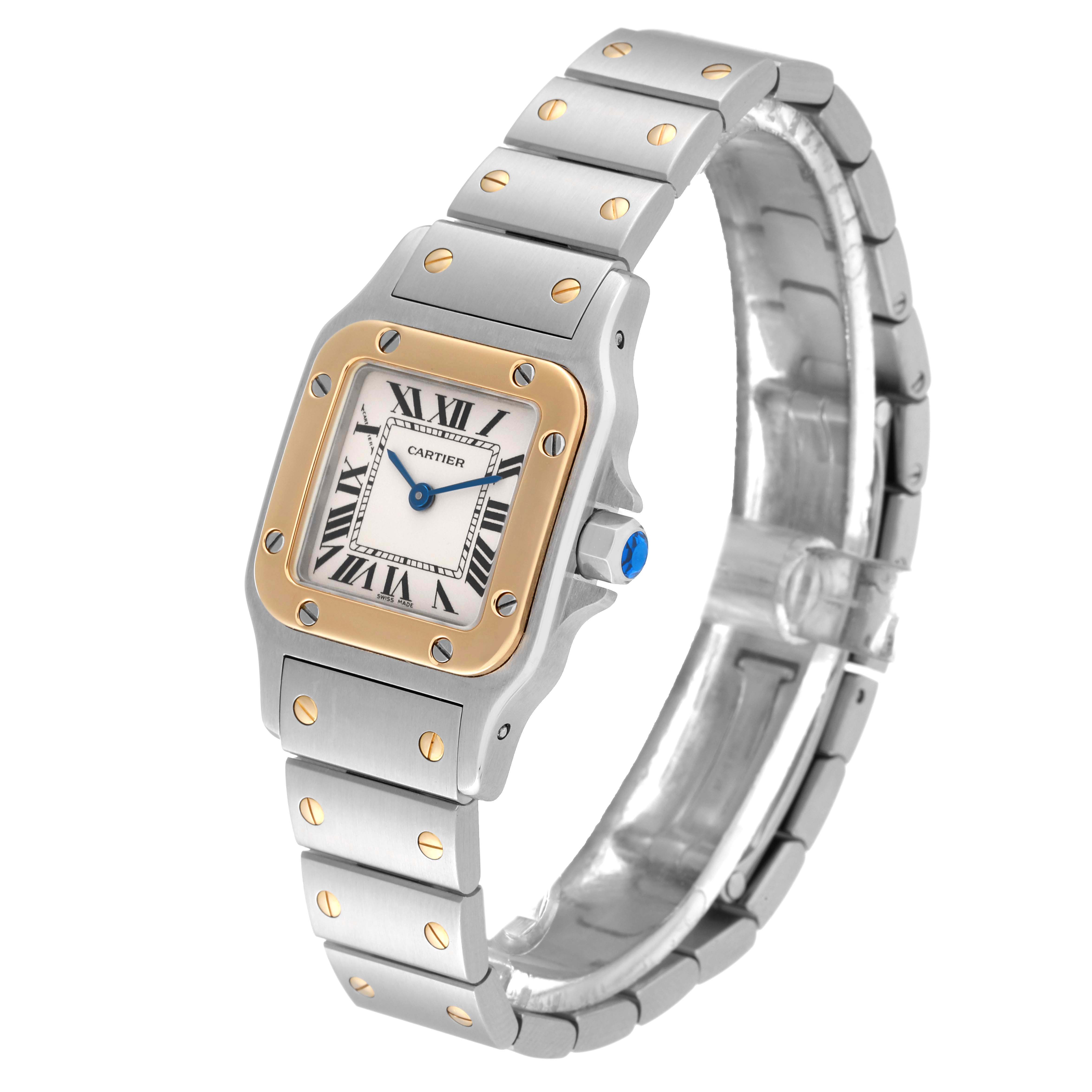 The image shows a Cartier Santos W20012C4 Women's Steel and Gold (two tone) Silver Dial W20012C4 Women's Steel and Gold (two tone) Silver Dial watch from an angled view, highlighting the face, bezel, crown, and part of the bracelet.