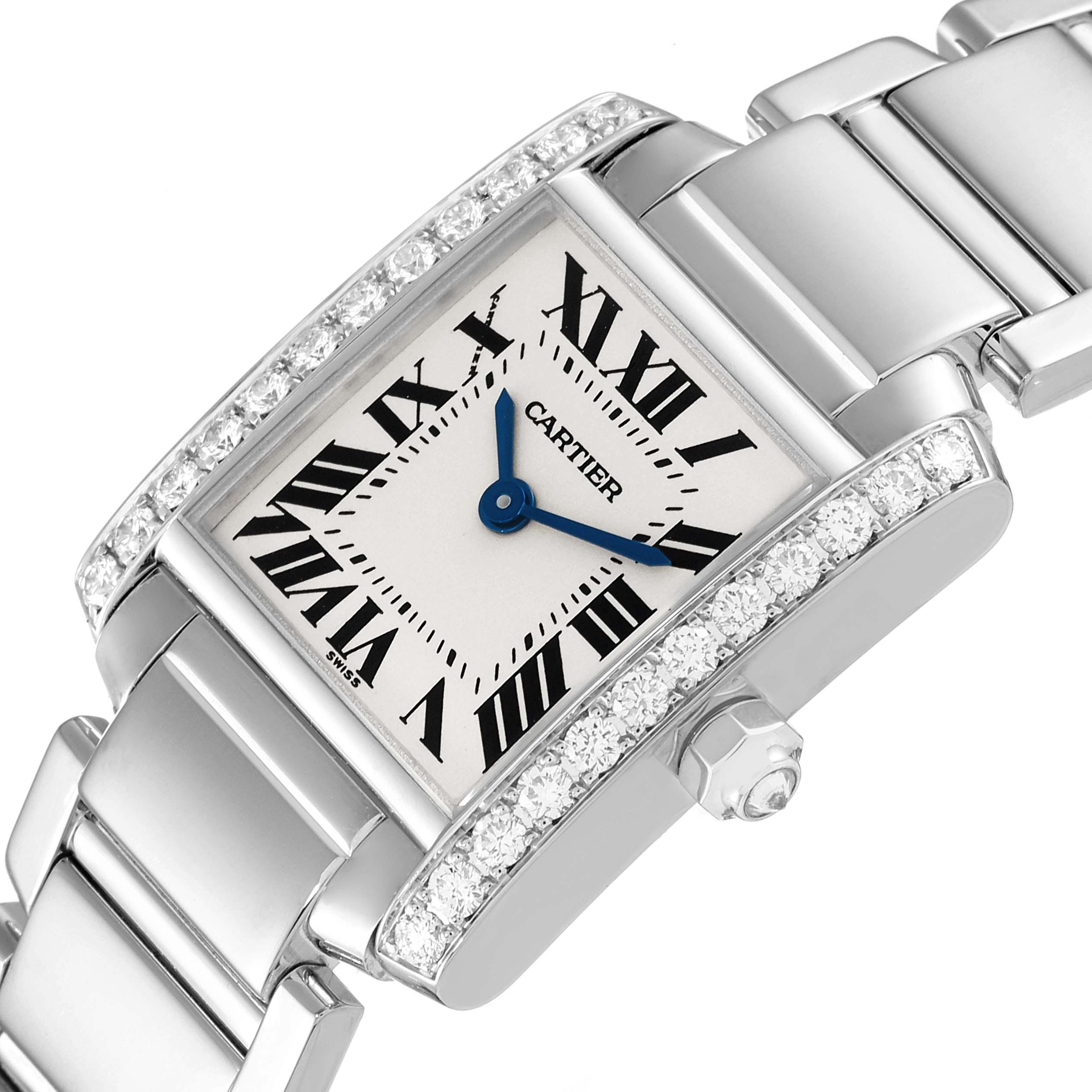 The image shows a top-view angle of the Cartier Tank Francaise WE1002S3 Women's White Gold Silver Dial WE1002S3 Women's White Gold Silver Dial watch, highlighting its face, bracelet, and gem-studded bezel.