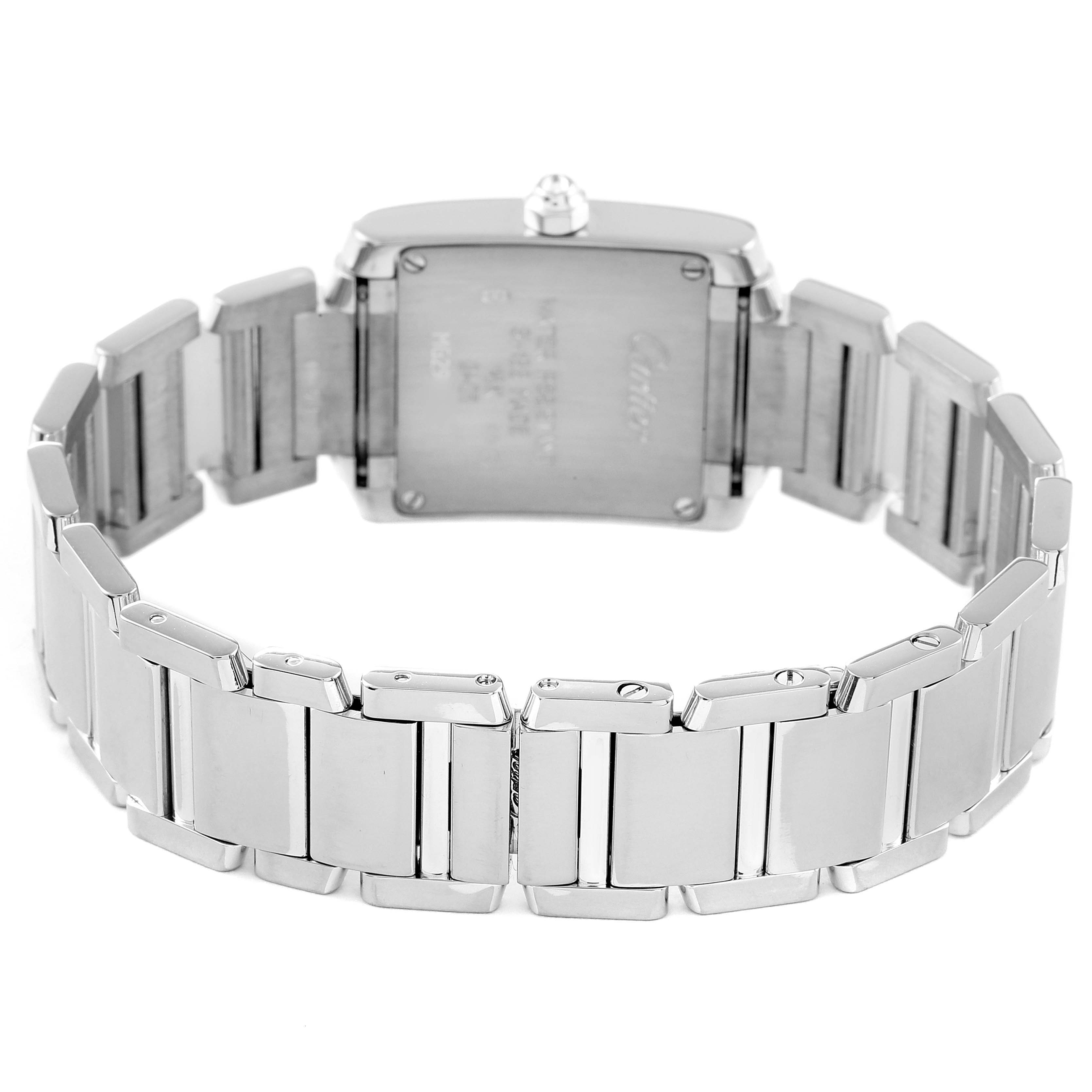 The image shows the back of a Cartier Tank Française watch, highlighting its rectangular case and metal bracelet.