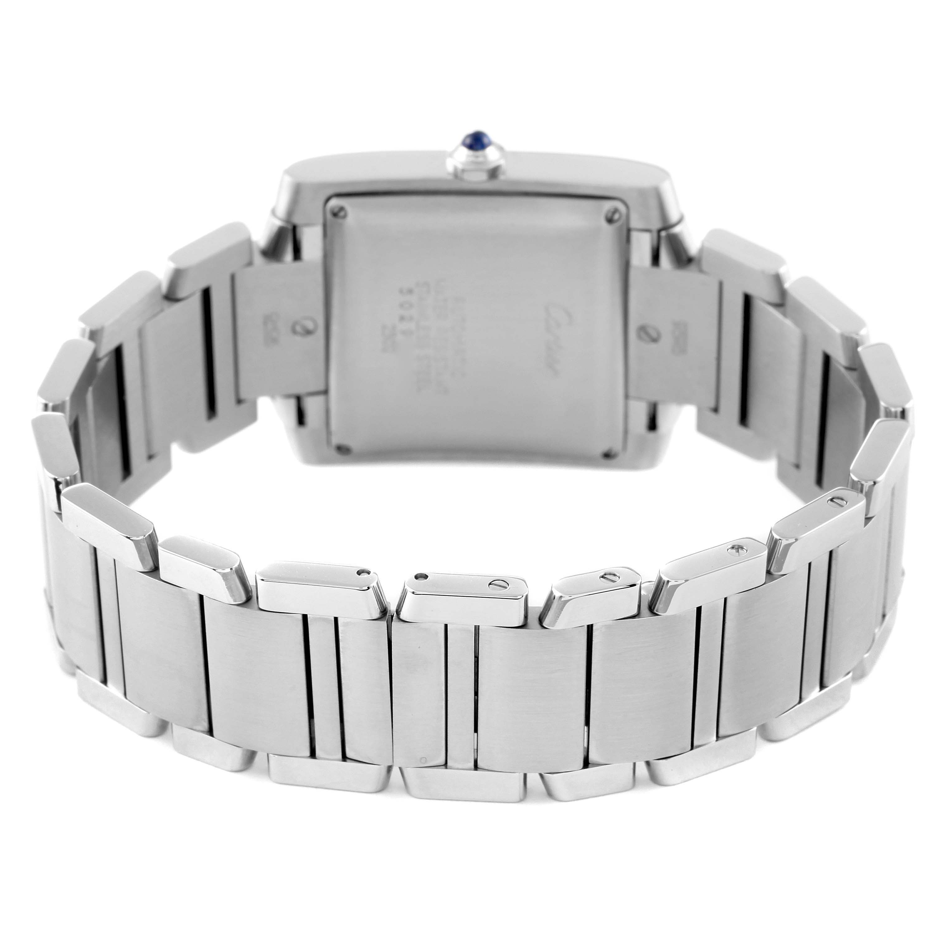 The image shows the back view of a Cartier Tank Française watch with its stainless steel bracelet.