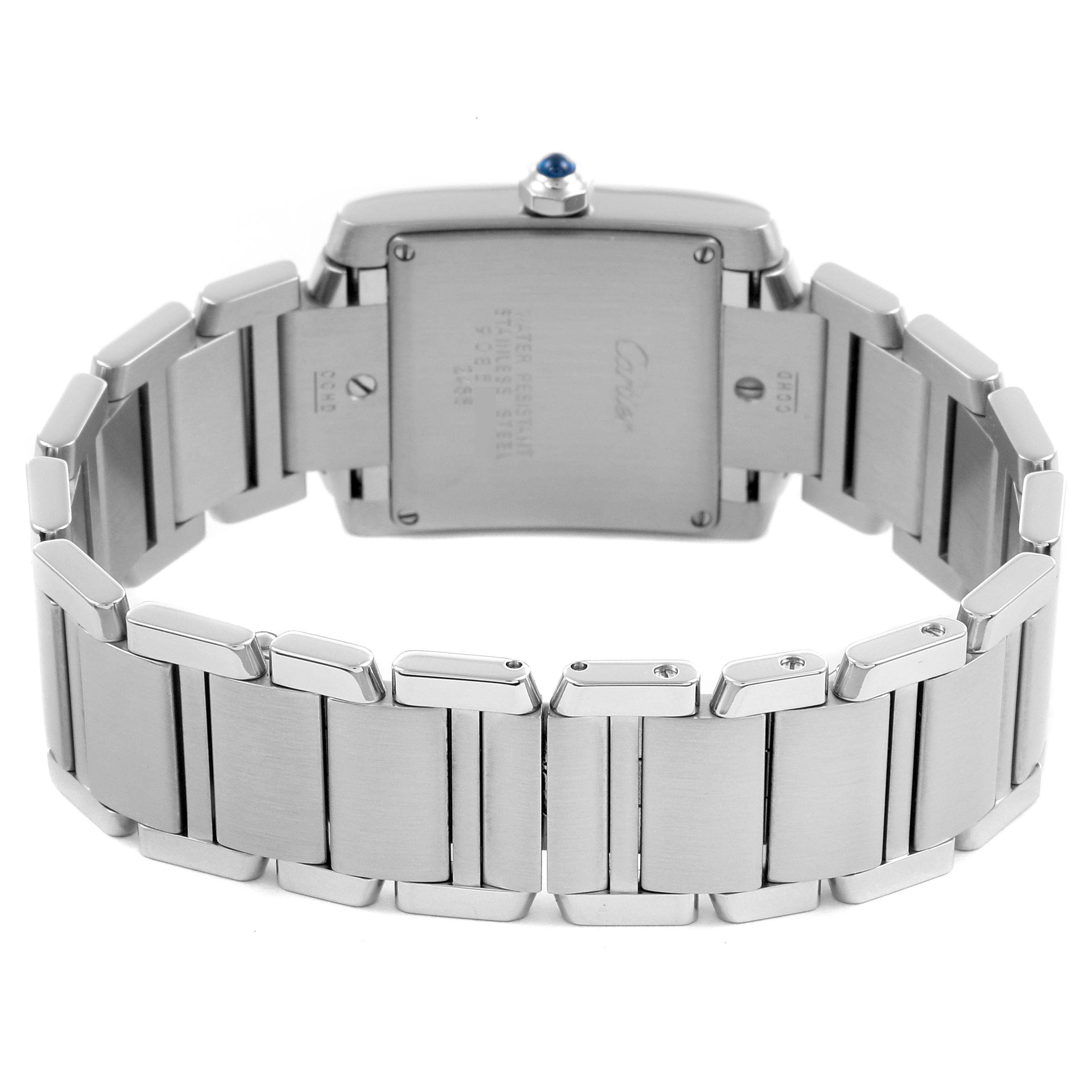 The image shows a rear view of the Cartier Tank Française watch, highlighting the back case and metal bracelet.