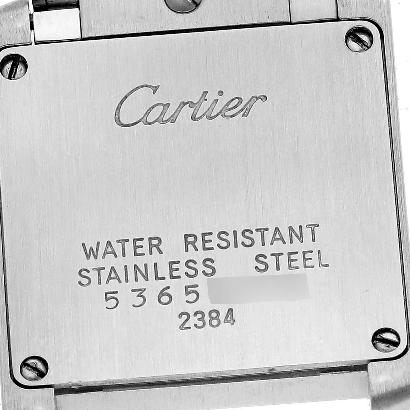 The image shows the back case of a Cartier Tank Française watch, highlighting its stainless steel construction and water resistance.