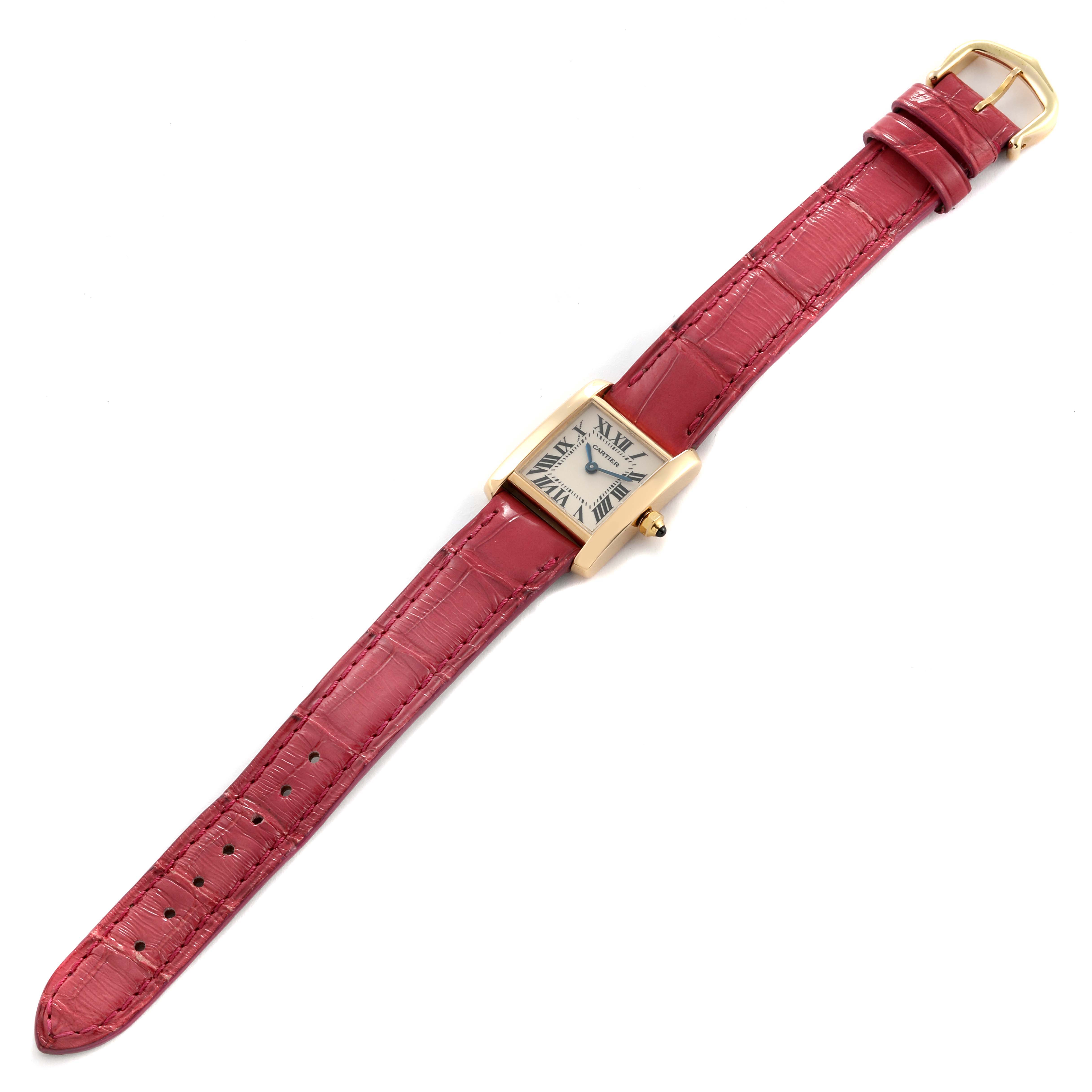 The Cartier Tank Francaise W5000256 Women
s Yellow Gold Silver Dial W5000256 Women
s Yellow Gold Silver Dial watch is shown from a top-down angle, displaying its face and full red leather strap.