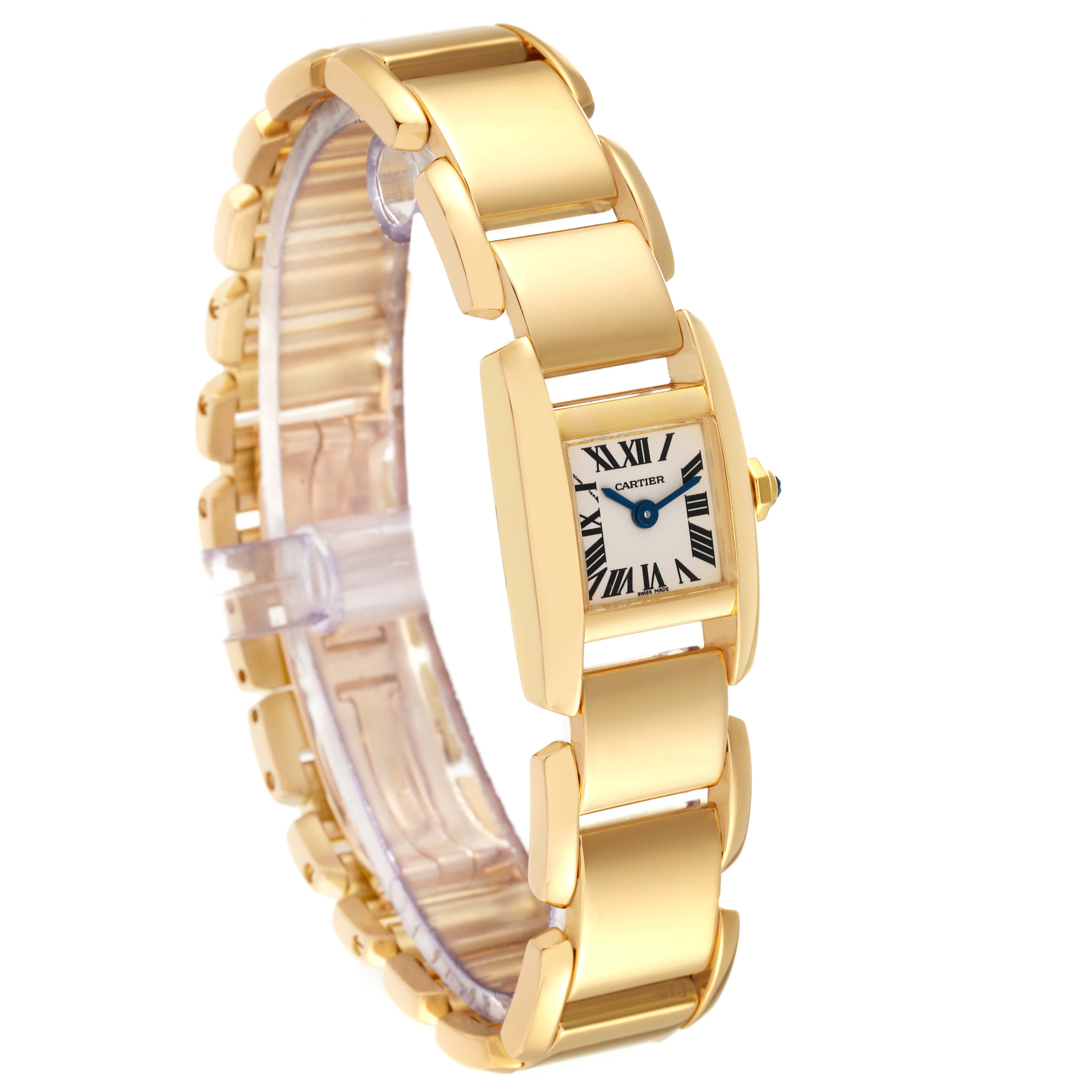 The image shows a Cartier Tankissime W650037H Women
s Yellow Gold Silver Dial W650037H Women
s Yellow Gold Silver Dial watch angled to display both its gold bracelet and rectangular face with Roman numerals.