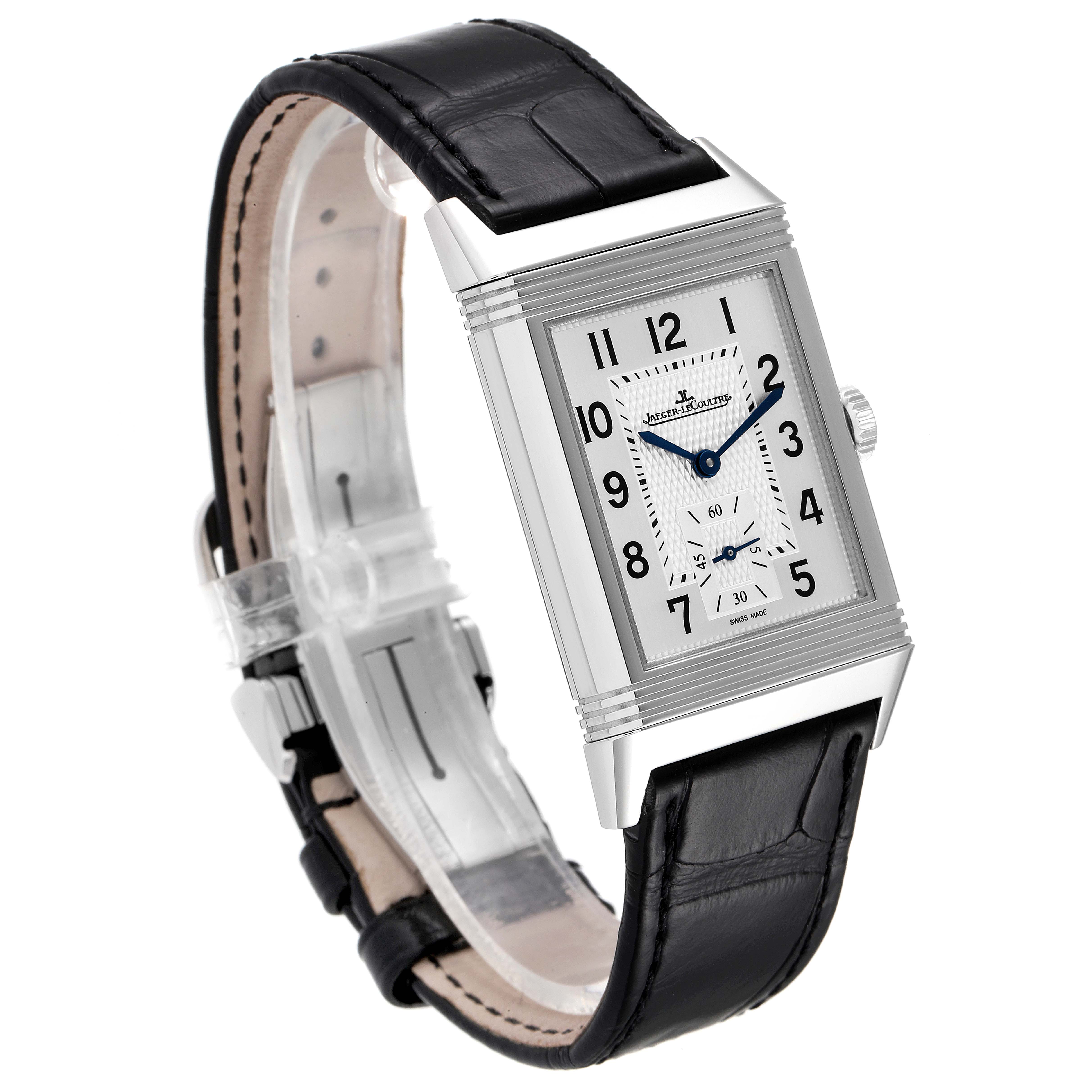 The Jaeger-LeCoultre Reverso watch is shown at a three-quarter angle, highlighting its front face and leather strap.