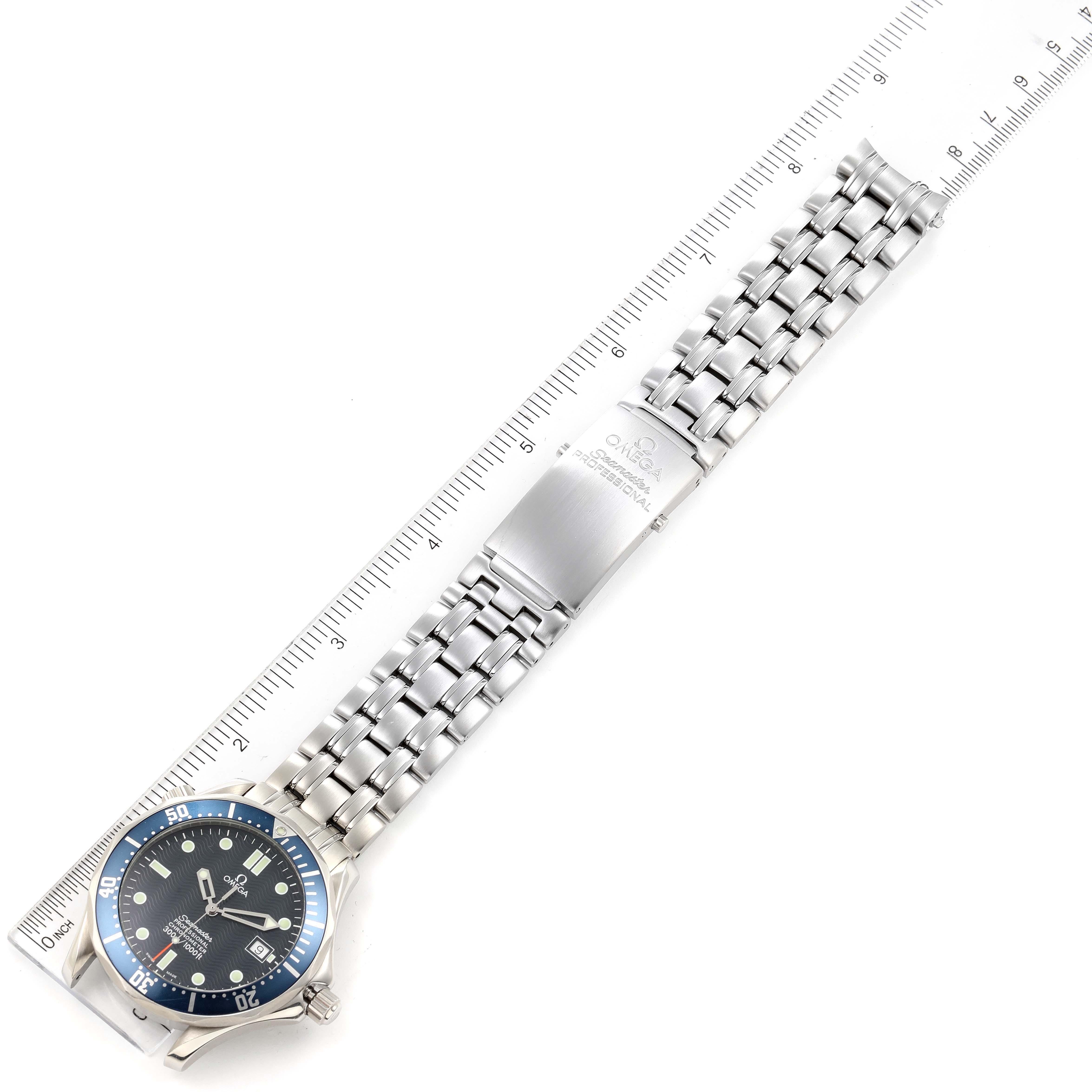 The image shows an Omega Seamaster 2531.80.00 Men's Stainless Steel Blue Dial 2531.80.00 Men's Stainless Steel Blue Dial watch laid flat with its face and metal bracelet visible, alongside a ruler for scale.