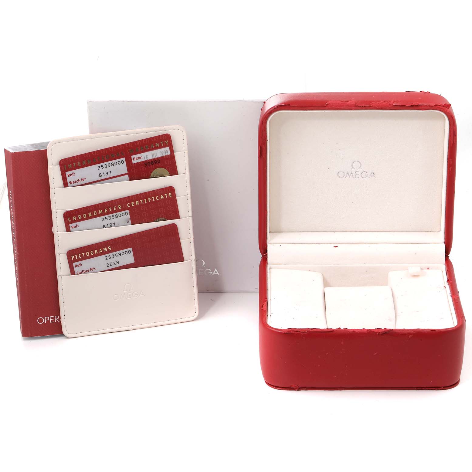 The image shows the accessories of an Omega Seamaster 2535.80.00 Men's Stainless Steel Blue Dial 2535.80.00 Men's Stainless Steel Blue Dial watch including the watch box, warranty cards, and holders.