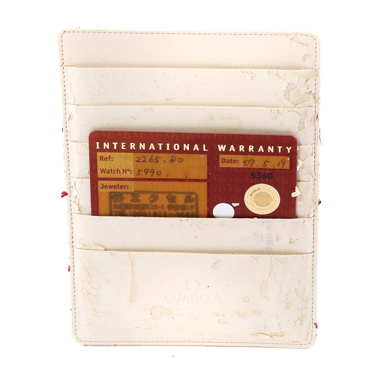 The image shows an Omega International Warranty card for a Seamaster model, displayed in a white holder.