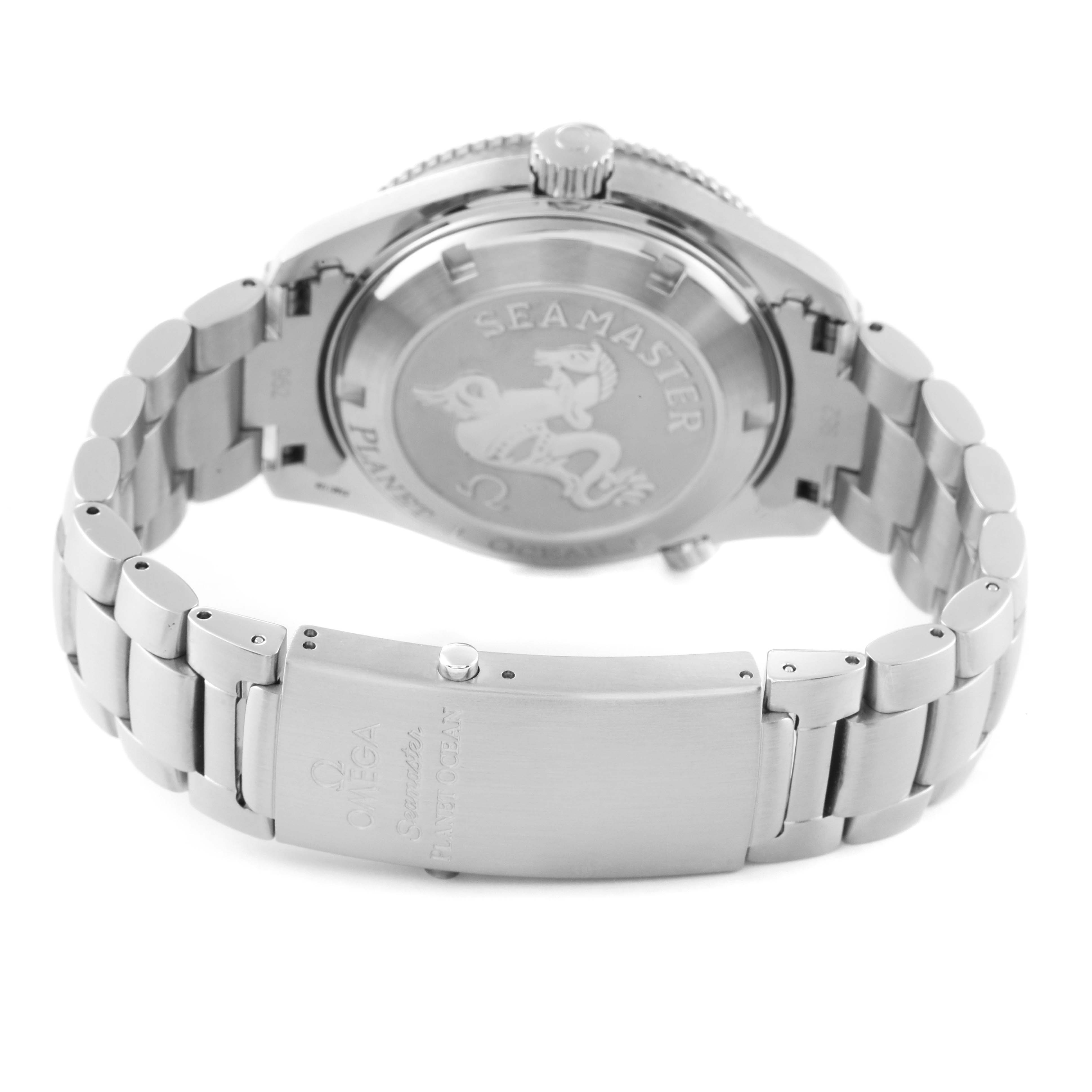 The image shows the back view of the Omega Seamaster Planet Ocean watch, focusing on the clasp and case back.