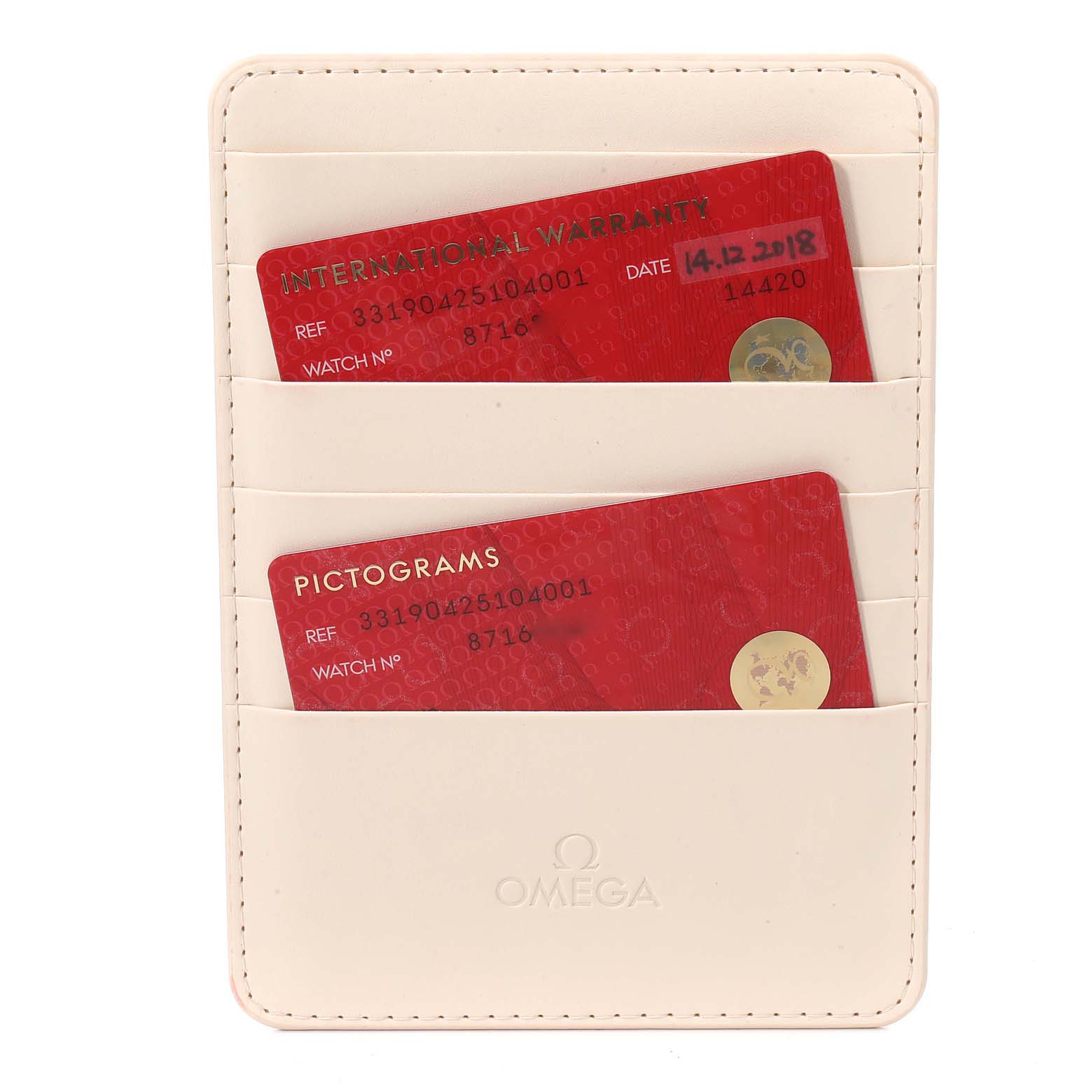 The image shows warranty and pictogram cards in a cardholder for an Omega Speedmaster 331.90.42.51.04.001 Men's Titanium White Dial 331.90.42.51.04.001 Men's Titanium White Dial watch.