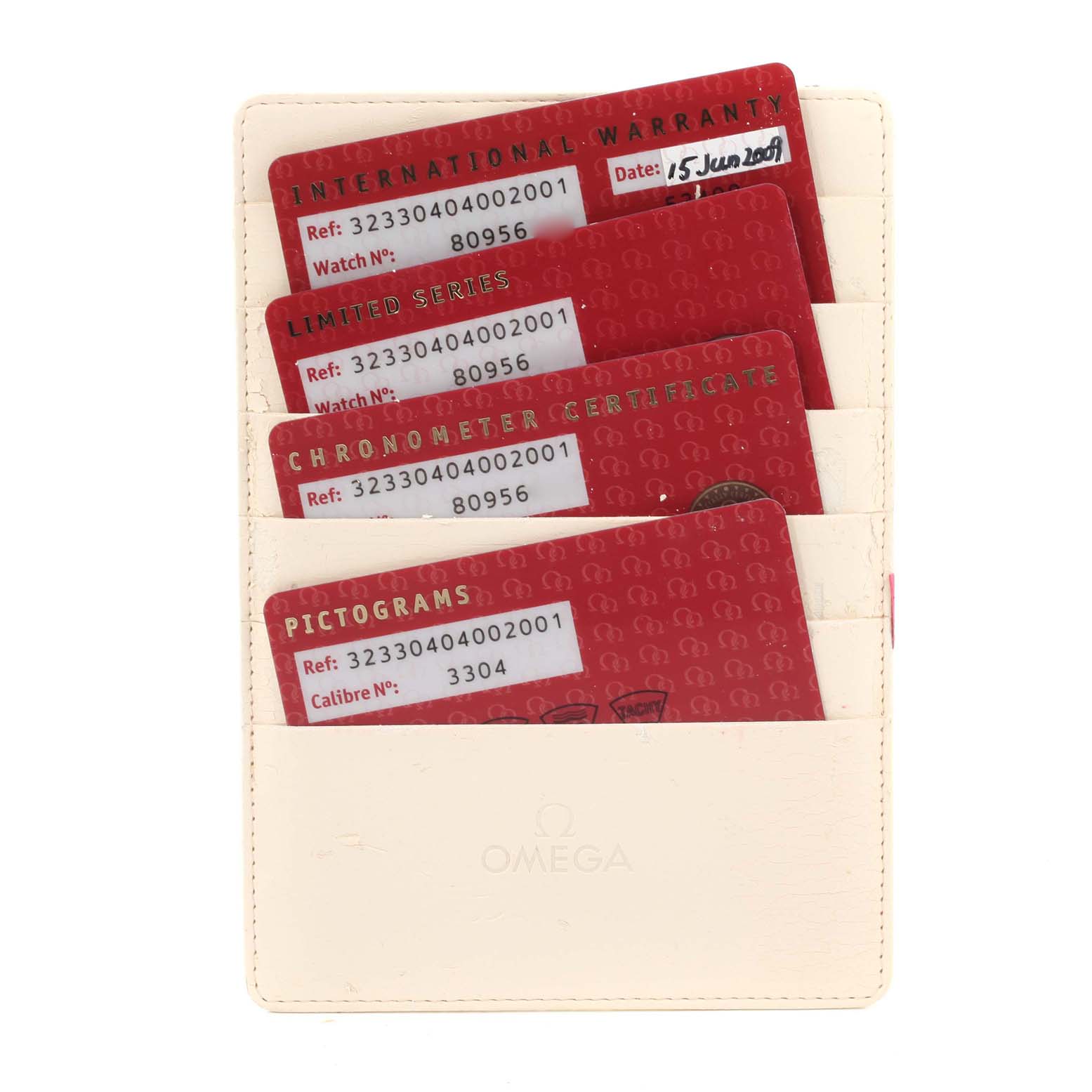 The image shows four Omega Speedmaster 323.30.40.40.02.001 Men's Stainless Steel White Dial 323.30.40.40.02.001 Men's Stainless Steel White Dial warranty and certification cards in a cream-colored holder, viewed from the front.