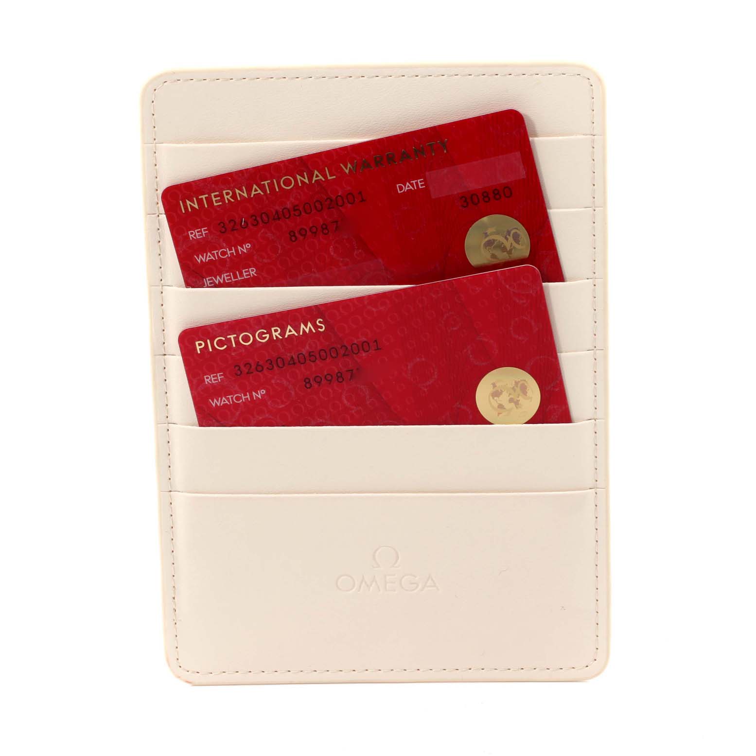 The image shows an Omega Speedmaster 326.30.40.50.02.001 Men's Stainless Steel Silver Dial 326.30.40.50.02.001 Men's Stainless Steel Silver Dial watch's warranty and pictogram cards in a holder, viewed from above.