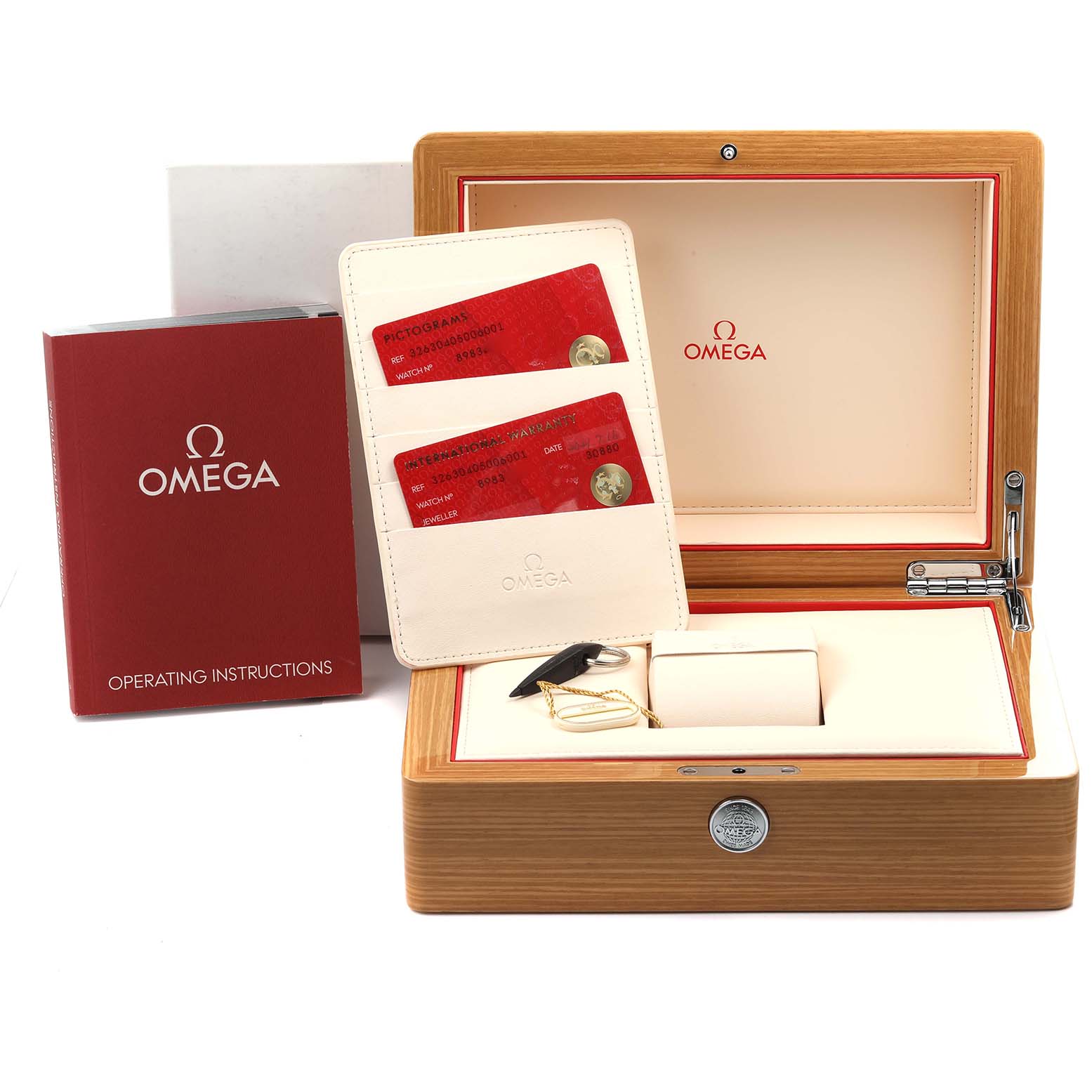 The image shows an Omega Speedmaster 326.30.40.50.06.001 Men's Stainless Steel Grey Dial 326.30.40.50.06.001 Men's Stainless Steel Grey Dial box set with a wooden case, cards, instructions, and a tool, viewed from the front.