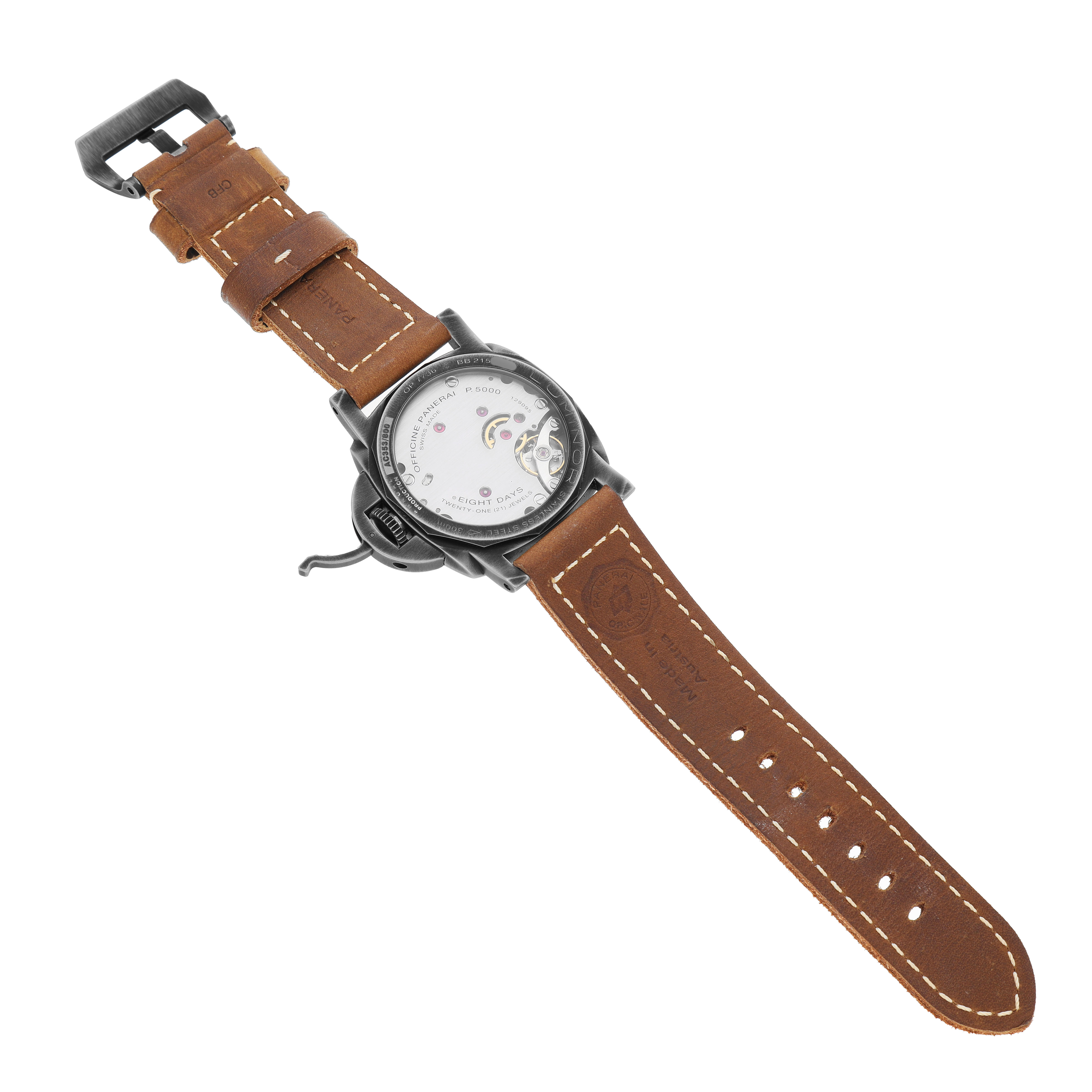 The Panerai Luminor PAM01733 Men's Stainless Steel Silver Dial watch is shown from a rear angle, highlighting the transparent case back and brown leather strap.