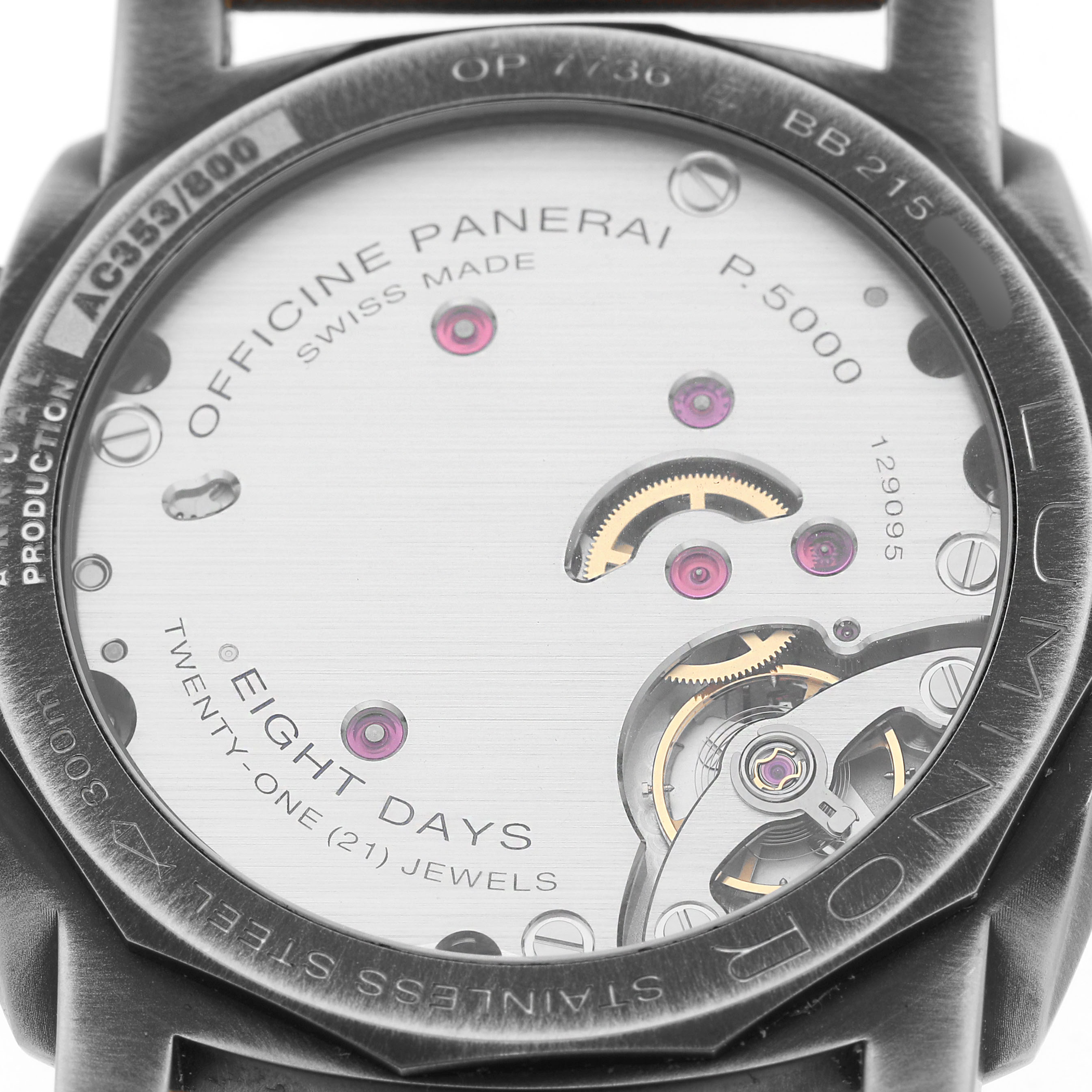 The image shows the back of a Panerai Luminor PAM01733 Men's Stainless Steel Silver Dial, revealing the P.5000 movement with intricate mechanical details and inscriptions.