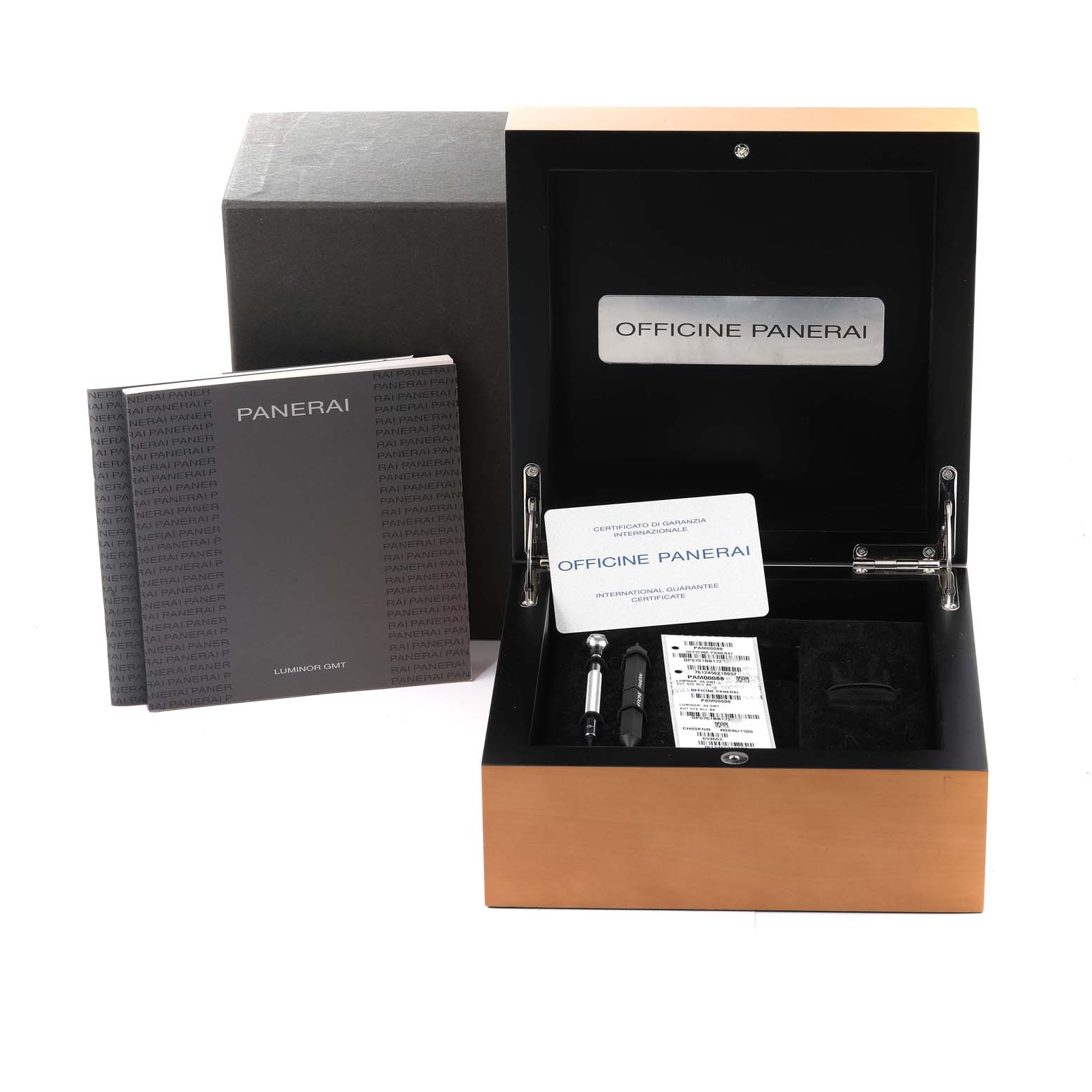 The image shows the Panerai Luminor PAM00088 Men
s Stainless Steel Black Dial PAM00088 Men
s Stainless Steel Black Dial
s box, documentation, and tools at a slightly elevated front angle.