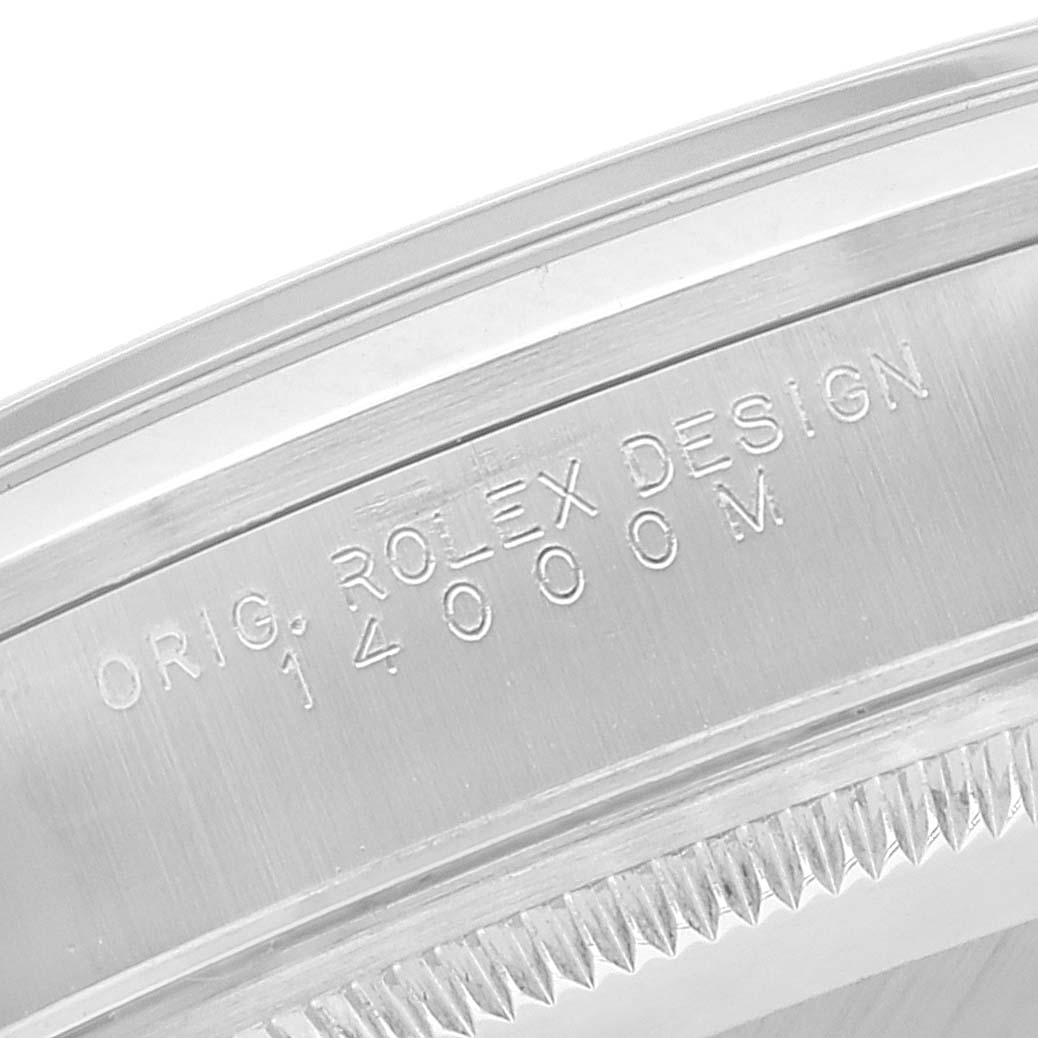 This close-up image shows the engraved bezel of a Rolex Air-King 14000M Men's Stainless Steel Black Dial 14000M Men's Stainless Steel Black Dial model watch.