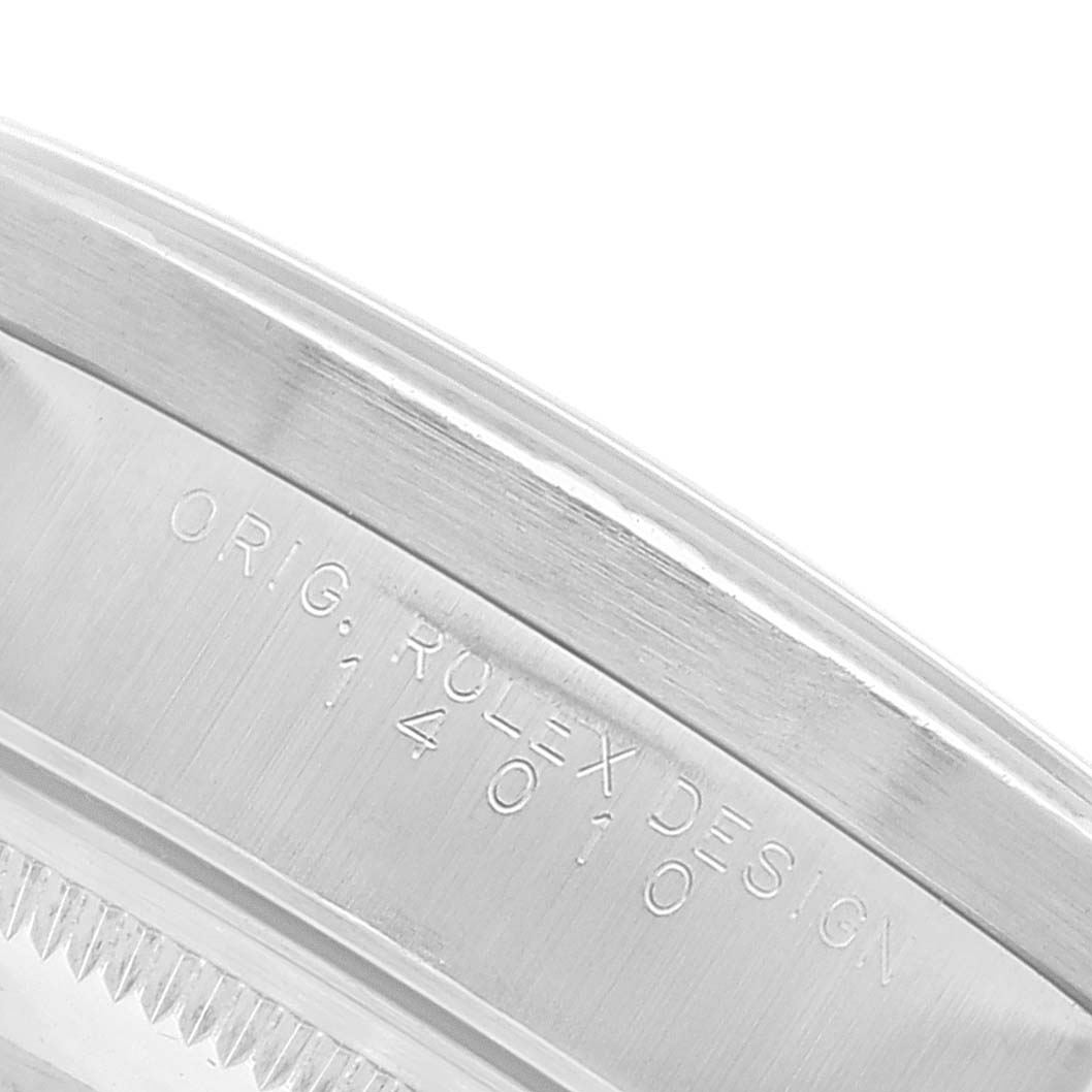 The image shows a close-up of the engraved side of the bezel of a Rolex Air-King 14010 Men's Stainless Steel Silver Dial 14010 Men's Stainless Steel Silver Dial watch.