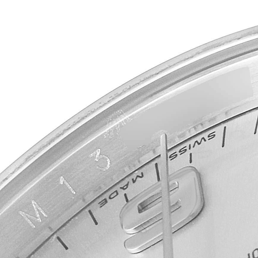 This image shows a close-up of the Air-King model by Rolex, focusing on part of the dial and hour markers.