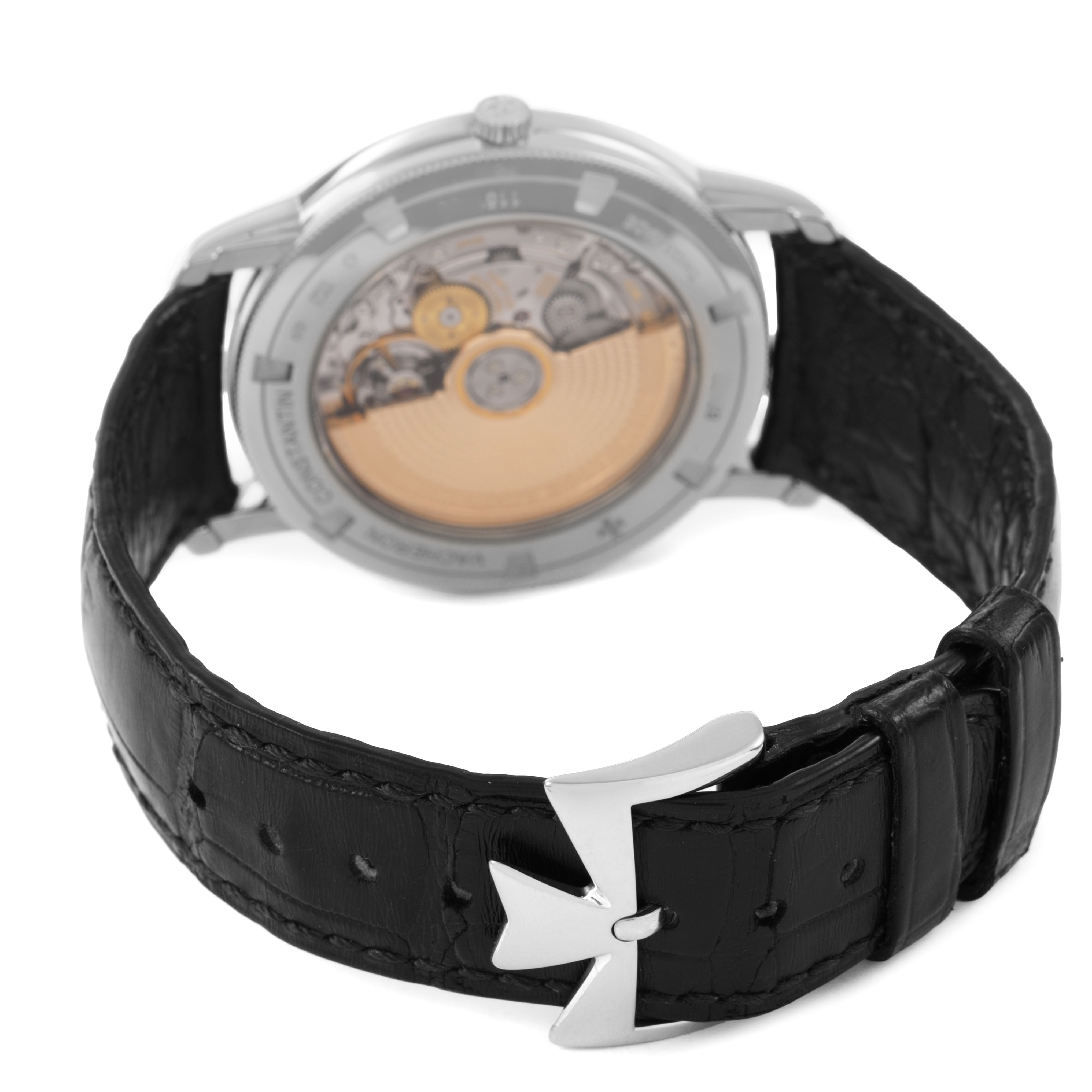 The image shows the back of the Vacheron Constantin Traditionnelle 87172/000G-9301 Men's White Gold Silver Dial watch, highlighting its movement and black strap with a clasp.