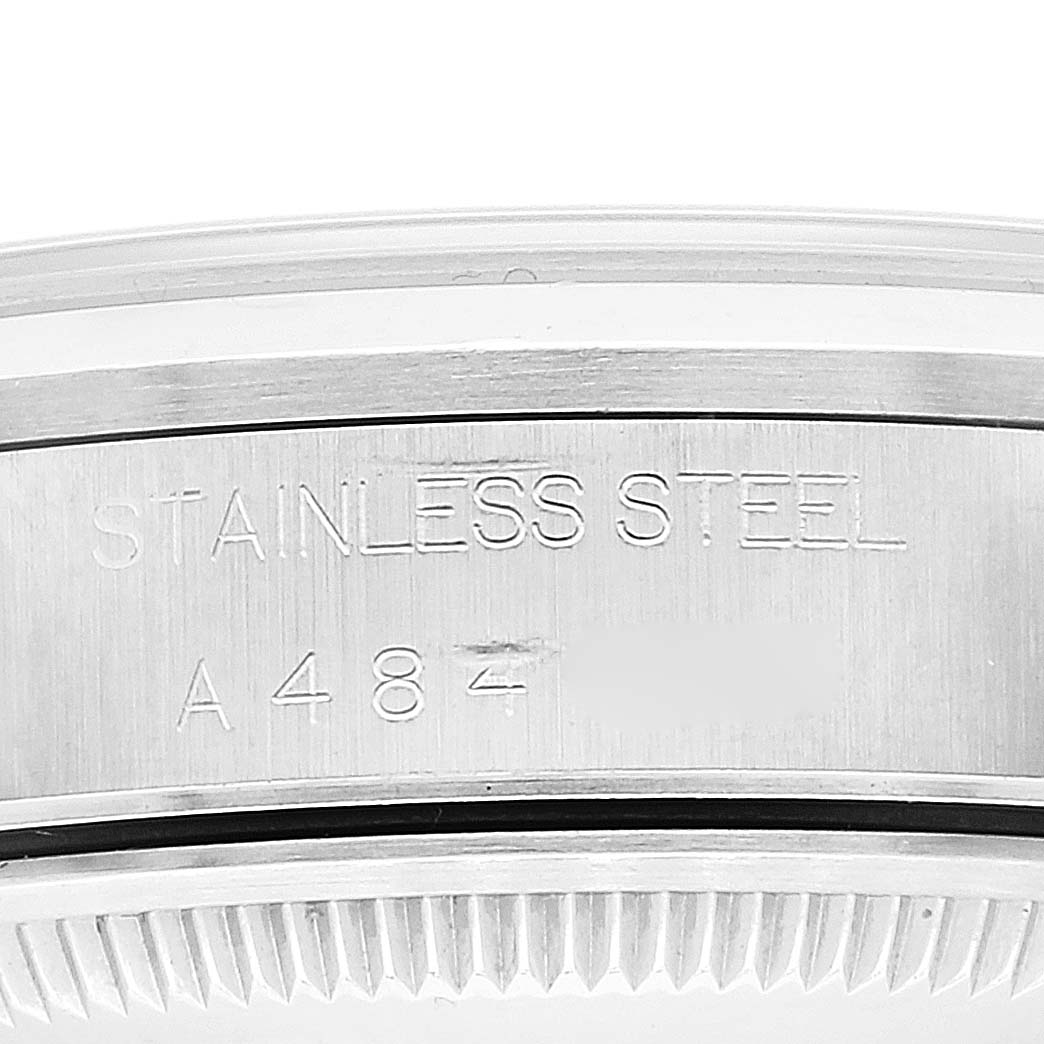 The image shows a close-up of the case back and serial number of a Rolex Date 15200 Men
s Stainless Steel Pink Dial 15200 Men
s Stainless Steel Pink Dial model watch, highlighting the stainless steel detail.