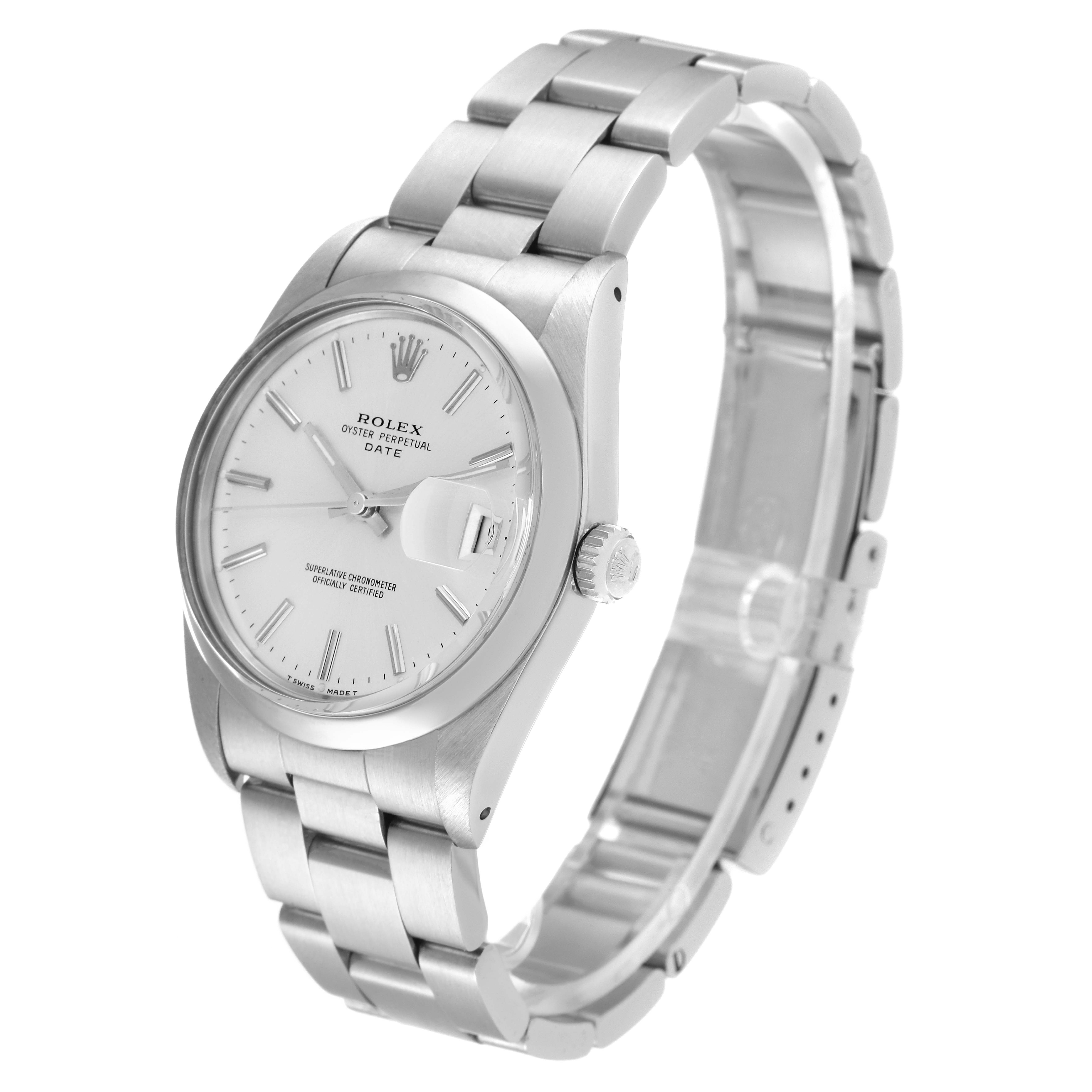 The image shows a Rolex Oyster Perpetual Date watch at a 3/4 angle, displaying the face, crown, and bracelet.