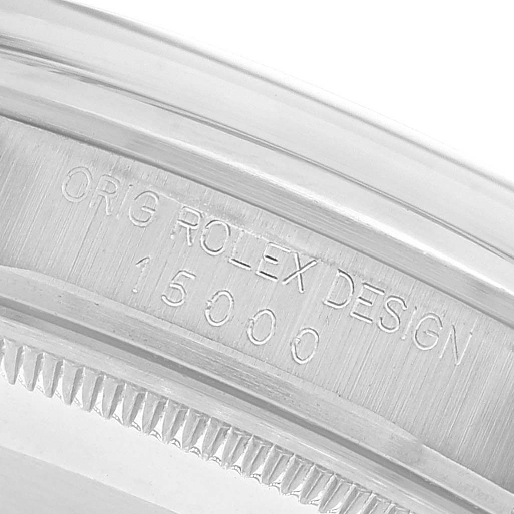 The image shows a close-up view of the case
s serial number engraving on a Rolex Date 15000 Men
s Stainless Steel Silver Dial 15000 Men
s Stainless Steel Silver Dial model watch.