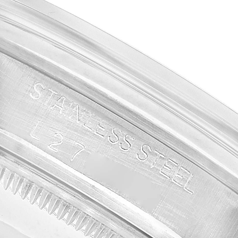 This image shows a close-up of the stainless steel case rim engraving of a Rolex Date 15000 Men
s Stainless Steel Silver Dial 15000 Men
s Stainless Steel Silver Dial model watch.