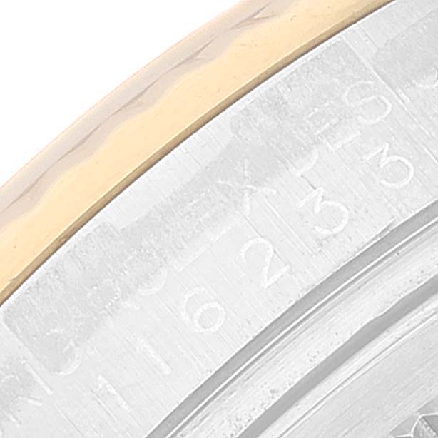 This image shows a close-up of the bezel and dial edge of a Rolex Datejust 116233 Men's Steel and Gold (two tone) Black Dial 116233 Men's Steel and Gold (two tone) Black Dial watch, focusing on the engraved numbering detail.