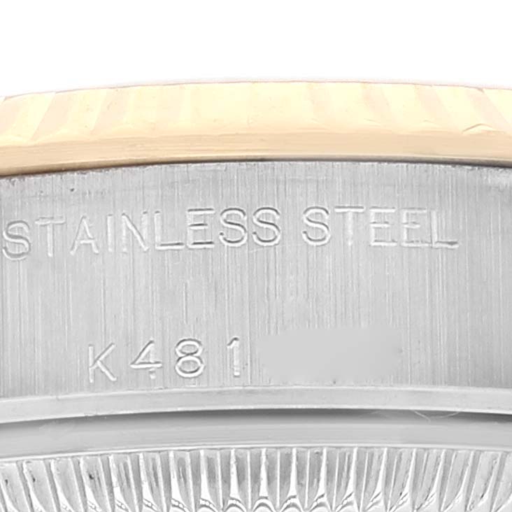 The image shows a close-up of the Datejust Rolex watch's stainless steel casing and part of its fluted bezel.