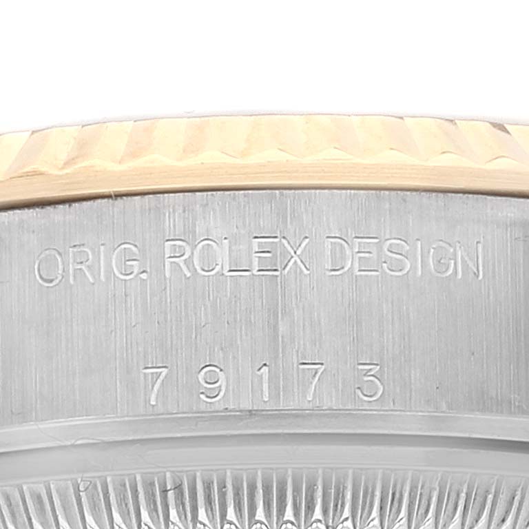 This image shows a close-up of the case with the engraved design number on the side of the Rolex Datejust 79173 Women's Steel and Gold (two tone) White Dial 79173 Women's Steel and Gold (two tone) White Dial watch.