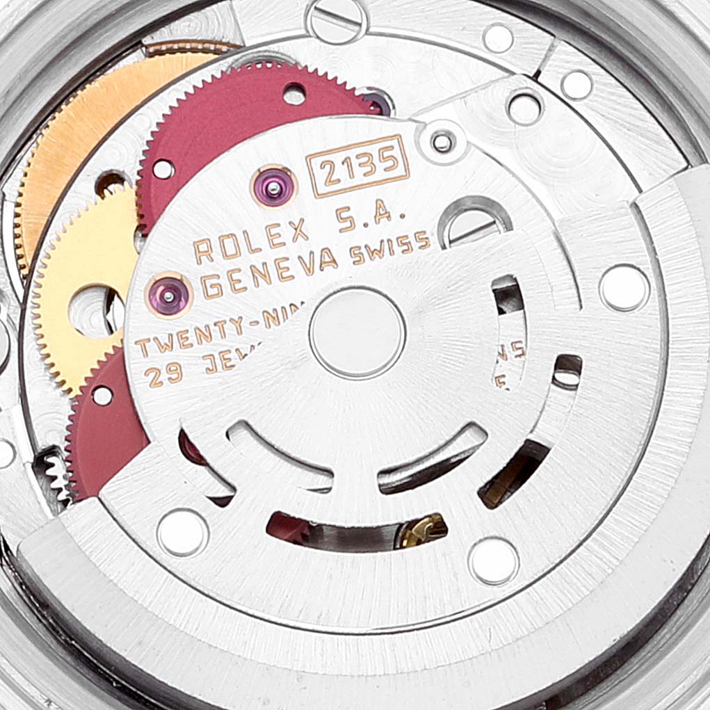 This image shows a close-up of the movement mechanism of a Rolex Datejust 69173 Women's Steel and Gold (two tone) White Dial 69173 Women's Steel and Gold (two tone) White Dial watch, displaying gears and components.