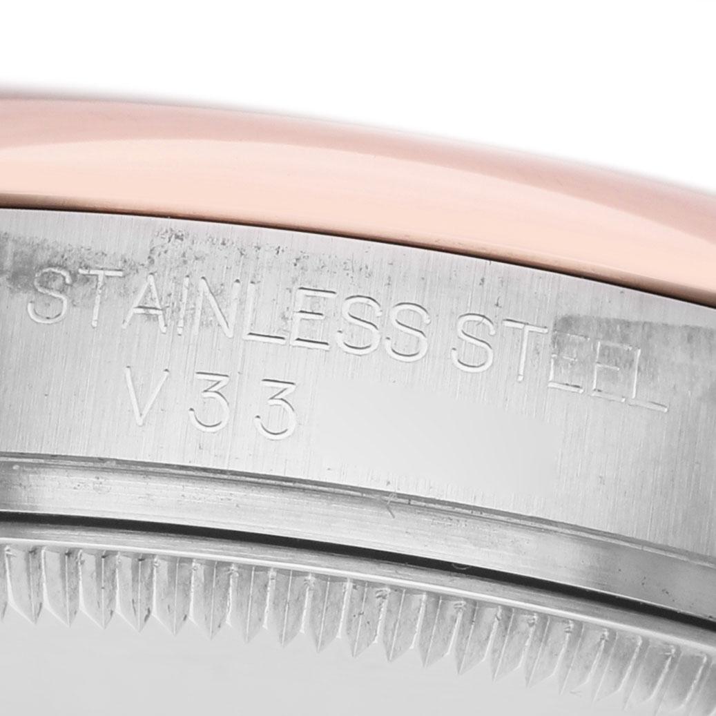 The image shows a close-up of the edge of a Rolex Datejust 178241 Women's Steel and Gold (two tone) Mother of Pearl Dial watch, highlighting the "STAINLESS STEEL" engraving.