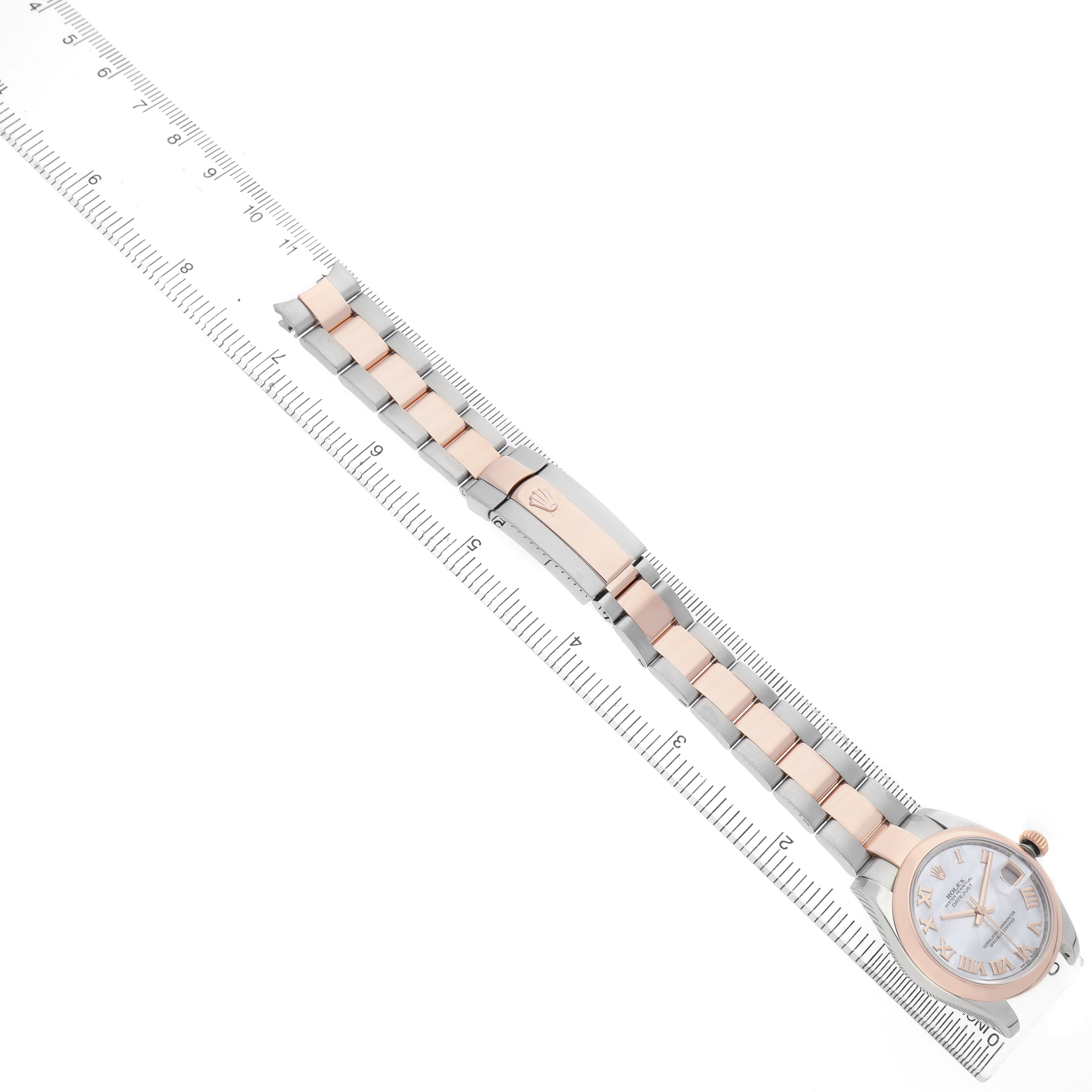 The Rolex Datejust 178241 Women's Steel and Gold (two tone) Mother of Pearl Dial watch is shown from a top-down angle, highlighting the bracelet, clasp, and face.