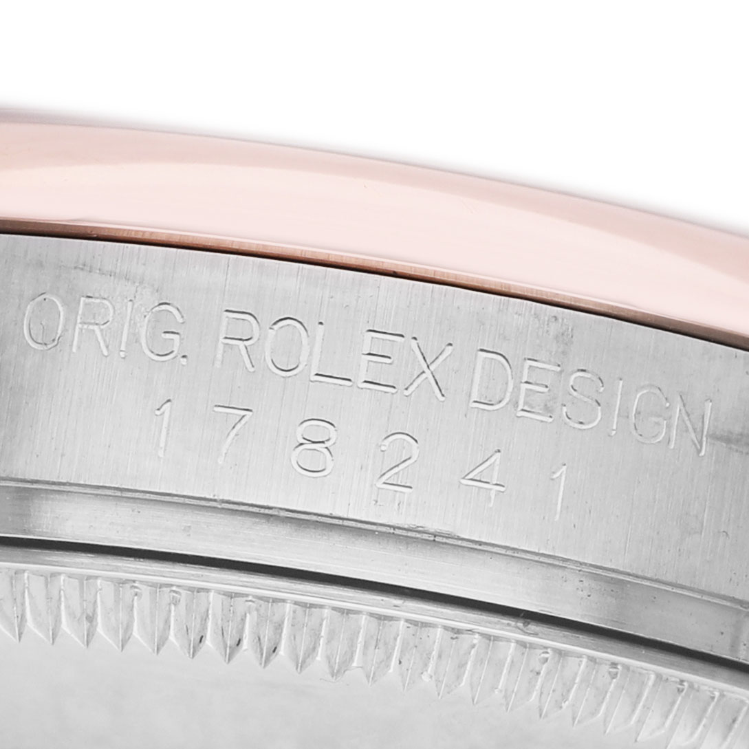 The image shows the side view of a Rolex Datejust 178241 Women's Steel and Gold (two tone) Mother of Pearl Dial watch, highlighting the engraved design and model number on the case edge.