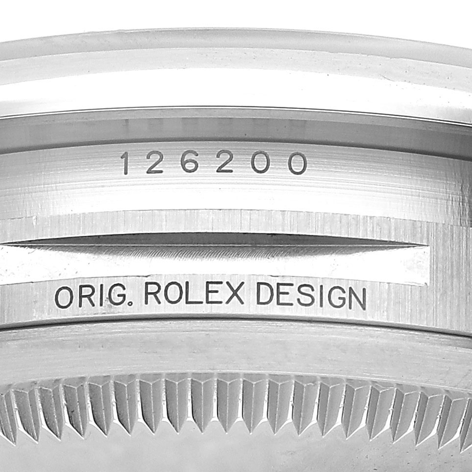The image shows a close-up of the inner rim and bezel of a Rolex Datejust 126200 Men's Stainless Steel Silver Dial, highlighting the model number and "Orig. Rolex Design" engraving.