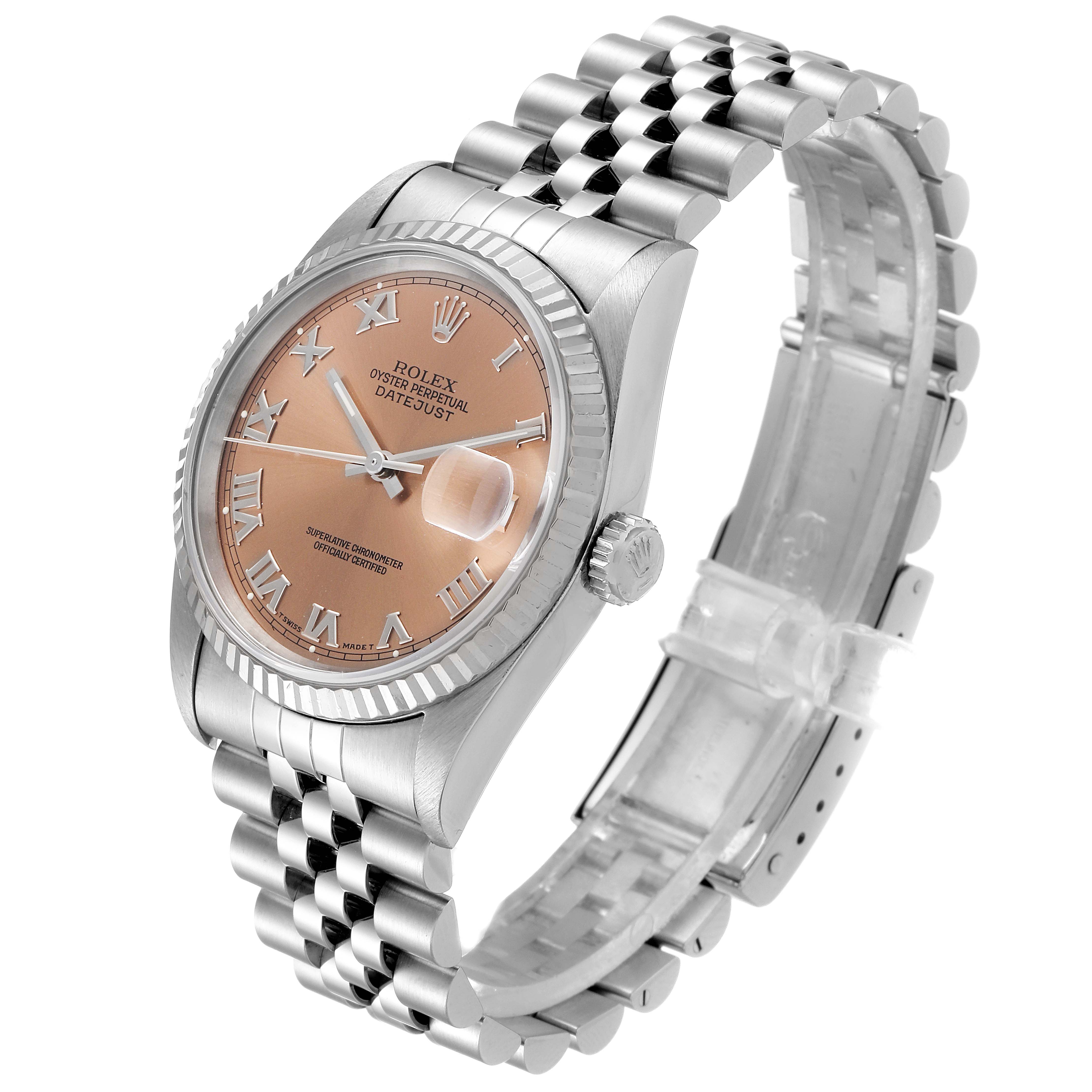 The Rolex Datejust 16234 Men's Steel and Gold (two tone) Pink Dial 16234 Men's Steel and Gold (two tone) Pink Dial watch is shown from an angled side view, highlighting the dial, bezel, crown, and bracelet.