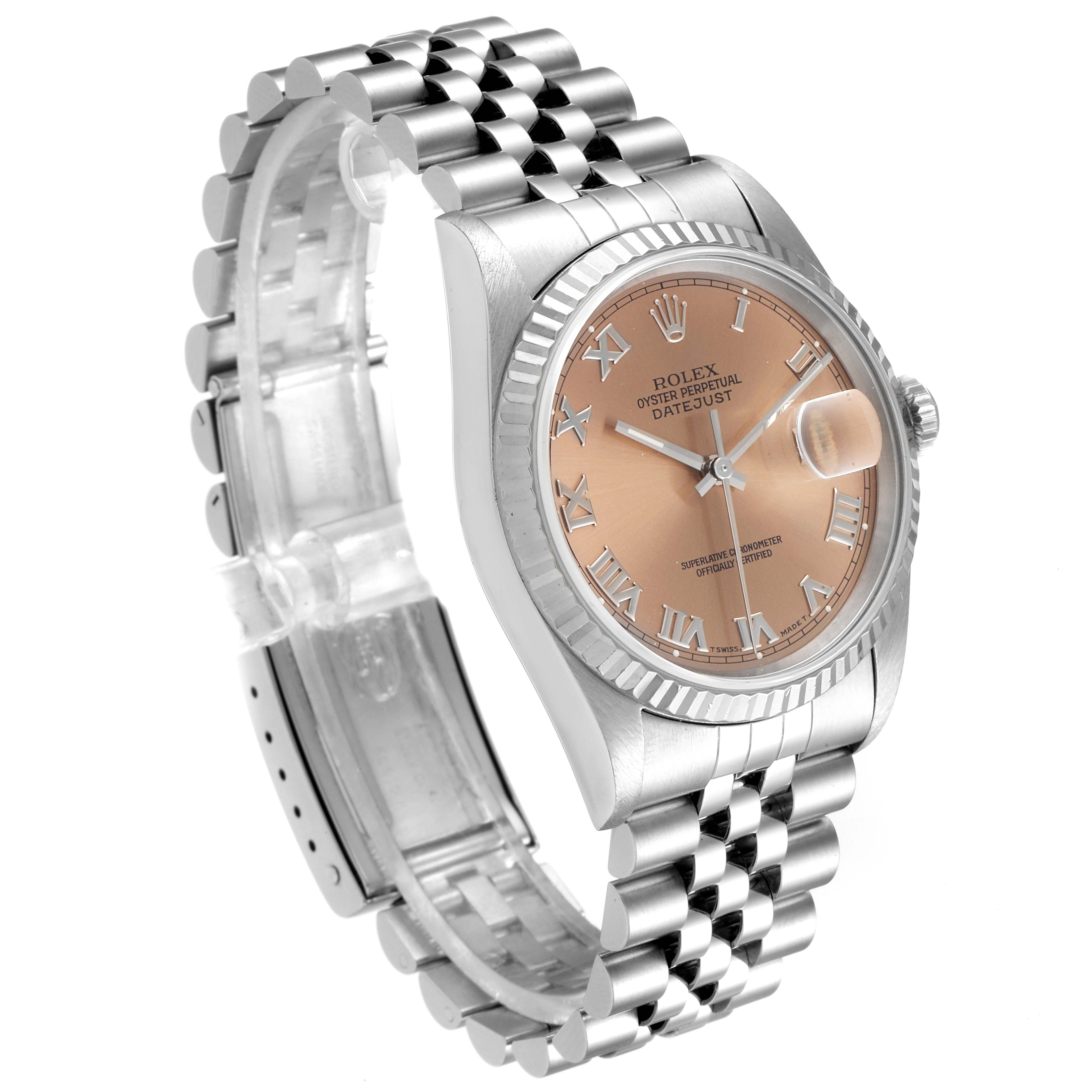 The Rolex Datejust 16234 Men's Steel and Gold (two tone) Pink Dial 16234 Men's Steel and Gold (two tone) Pink Dial watch is shown at an angle showcasing the face, bezel, crown, and Jubilee bracelet.