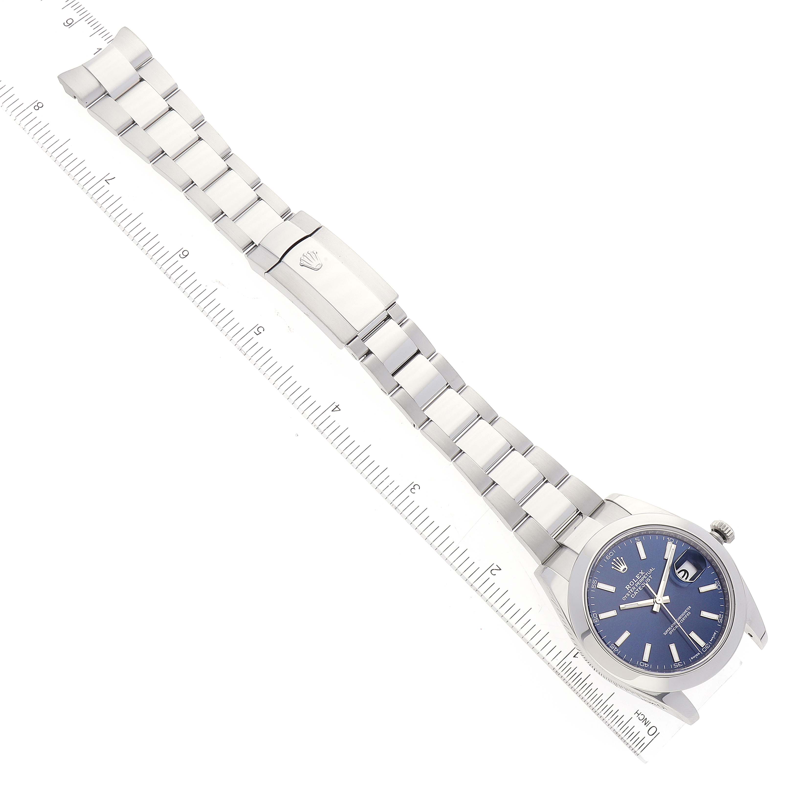 This image shows the full length of a Rolex Datejust 41 126300 Men's Stainless Steel Blue Dial 126300 Men's Stainless Steel Blue Dial watch, including its dial, bracelet, and clasp, displayed alongside a ruler.