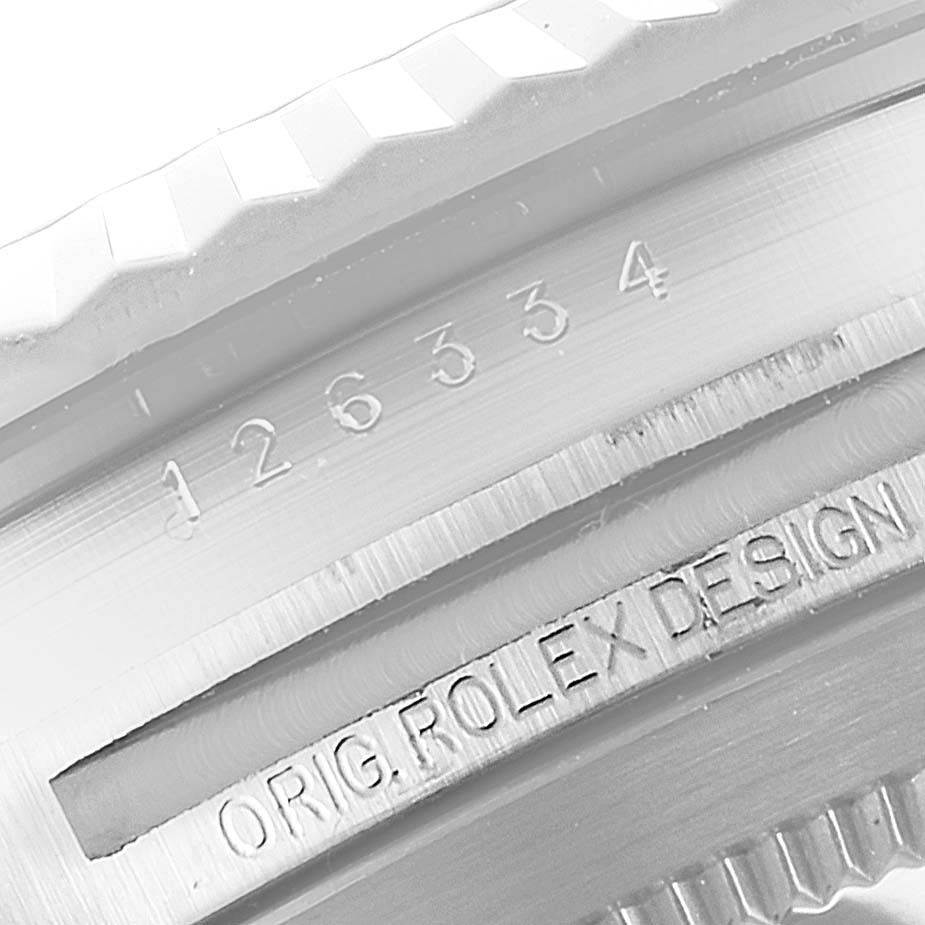 This image shows an angled close-up of the serial number and "Orig. Rolex Design" engraving on the bezel of the Rolex Datejust 41 126334 Men
s Stainless Steel White Dial 126334 Men
s Stainless Steel White Dial watch.