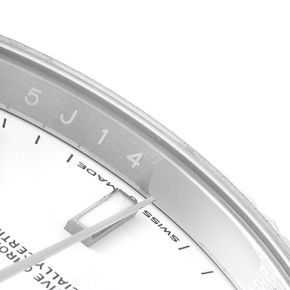 The image shows a close-up angle of the Rolex Datejust 41 126334 Men
s Stainless Steel White Dial 126334 Men
s Stainless Steel White Dial watch, highlighting part of the dial and a date window. 