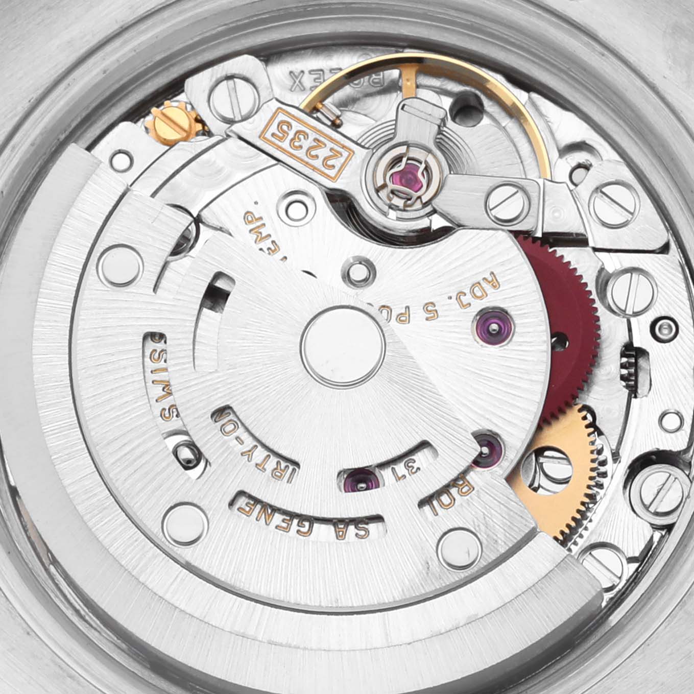 The image shows the movement of a Rolex Datejust 179173 Women's Steel and Gold (two tone) Champagne Dial 179173 Women's Steel and Gold (two tone) Champagne Dial watch from a top-down angle, highlighting gears and balance components.