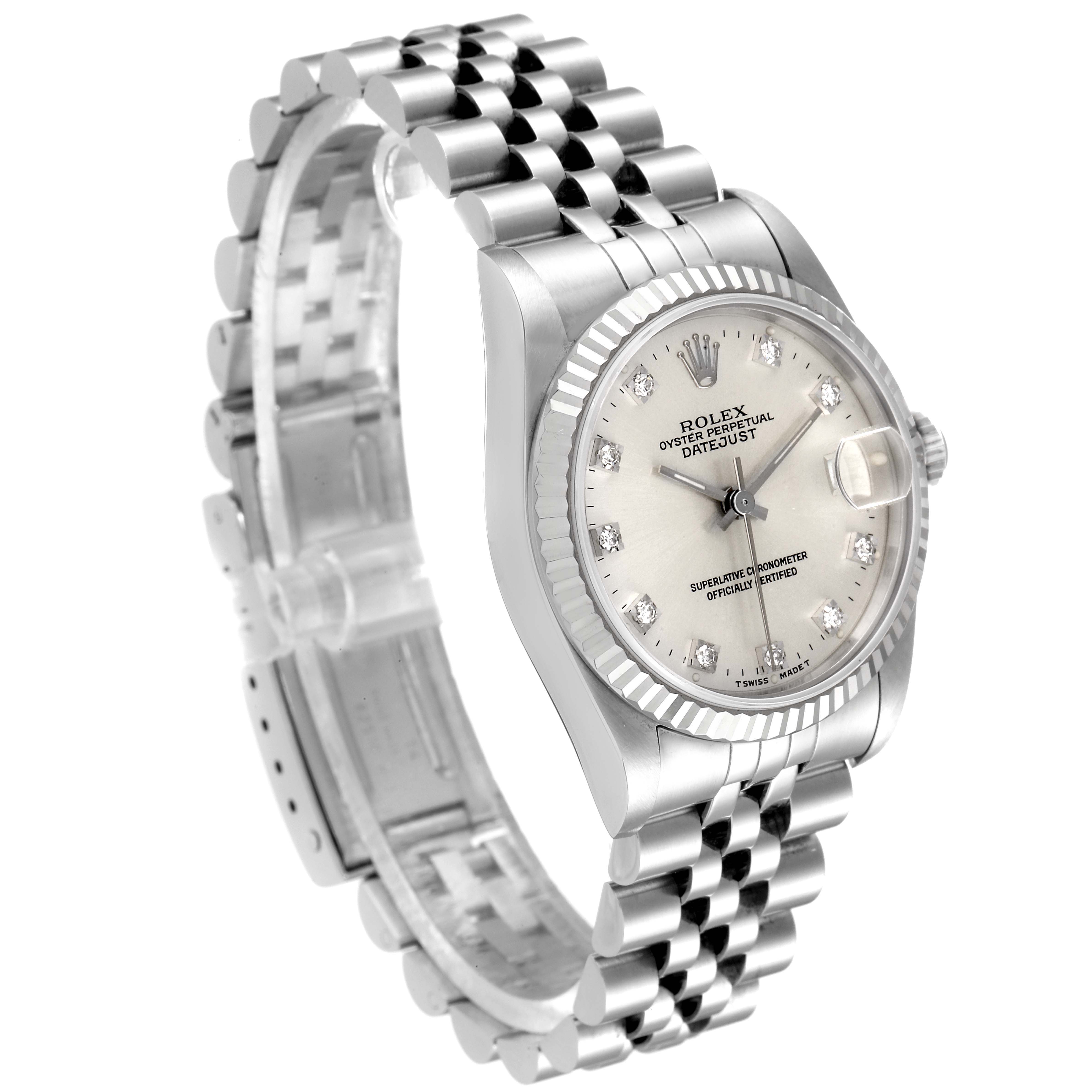 This Mid-Size Rolex watch is shown from a three-quarter angle, highlighting the face, bracelet, clasp, and dial details.