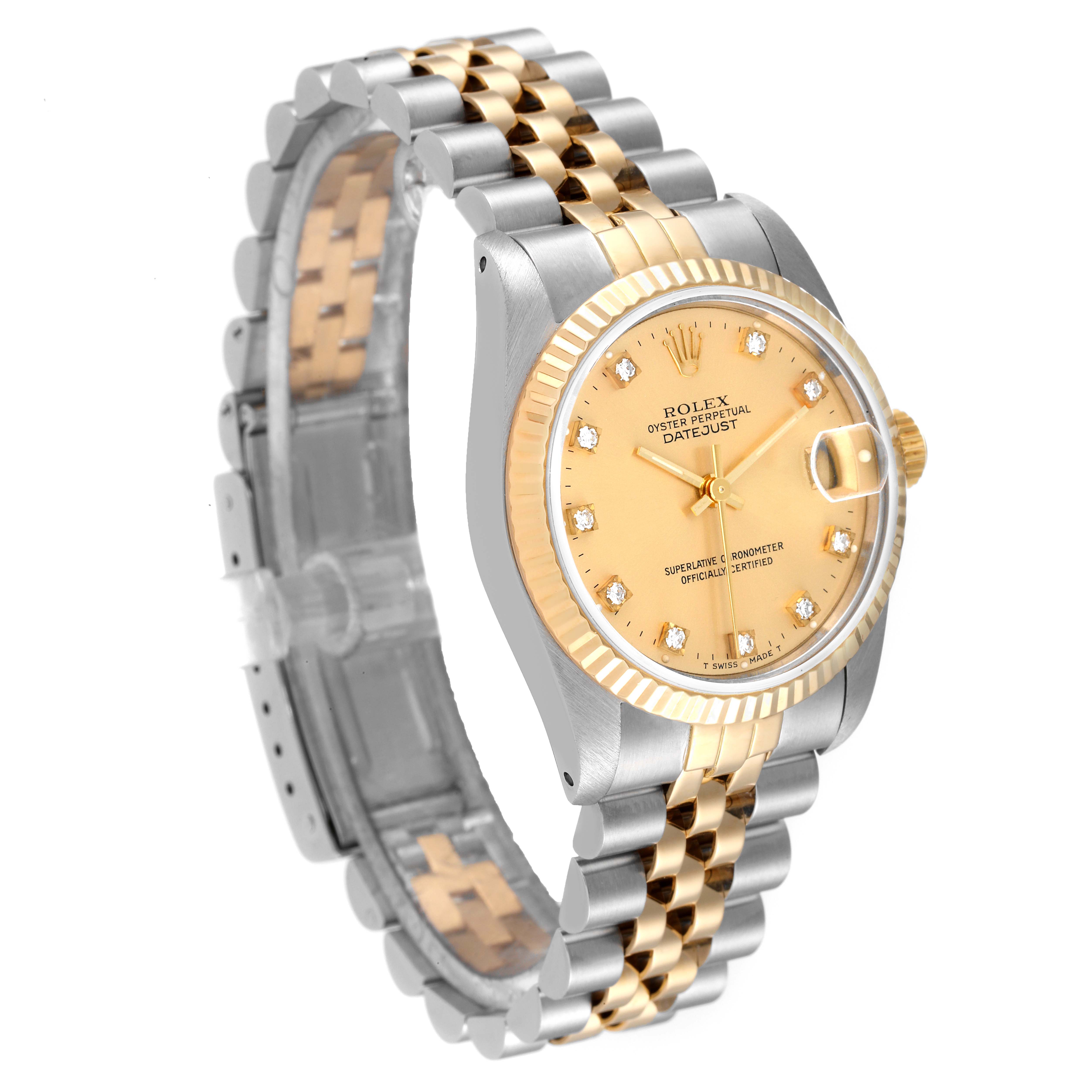 The image shows a Mid-Size Rolex Datejust watch from an angled side view, highlighting its gold and silver bracelet and champagne dial.