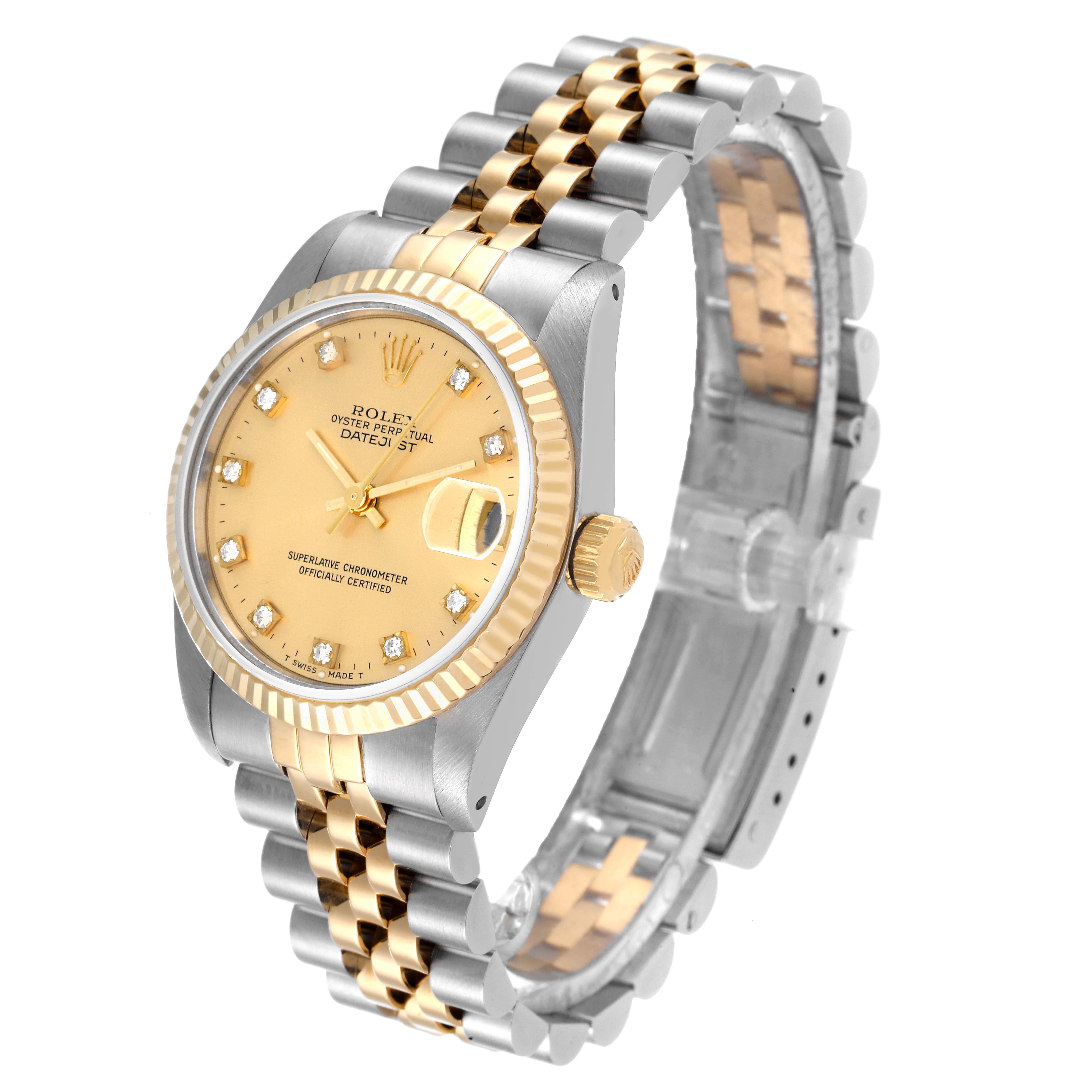 The Rolex Mid-Size 68273 Women
s Steel and Gold (two tone) Champagne Dial 68273 Women
s Steel and Gold (two tone) Champagne Dial watch features a gold face, diamond hour markers, a date window, and a two-tone bracelet, viewed from an angled top-down perspective.
