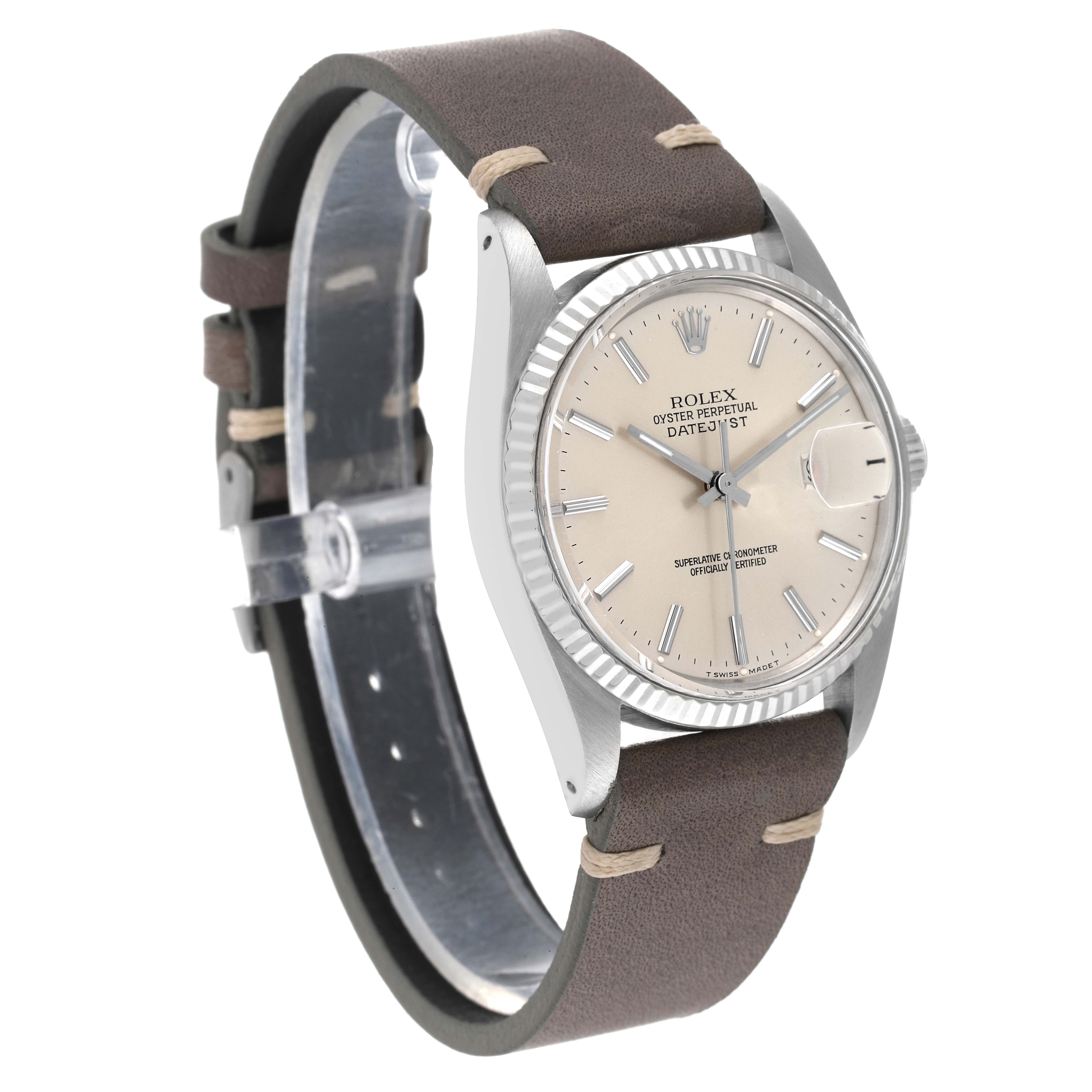 The Rolex Datejust 16014 Men's Steel and Gold (two tone) Silver Dial 16014 Men's Steel and Gold (two tone) Silver Dial watch is shown at a slight angled side view, highlighting the dial, bezel, and leather strap.